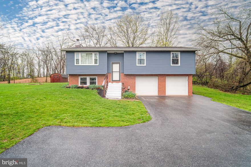 This raised ranch in the Northeastern School District is a must-see. It features 3 bedrooms, 1 bathroom, and a bright, inviting main living area on the upper level with easy access to a spacious deck—perfect for morning coffee or entertaining. The two-car garage offers extra storage or parking, and the half-acre lot is low-maintenance while still providing space for outdoor activities.  Enjoy the perfect mix of peaceful living and the convenience of nearby amenities.