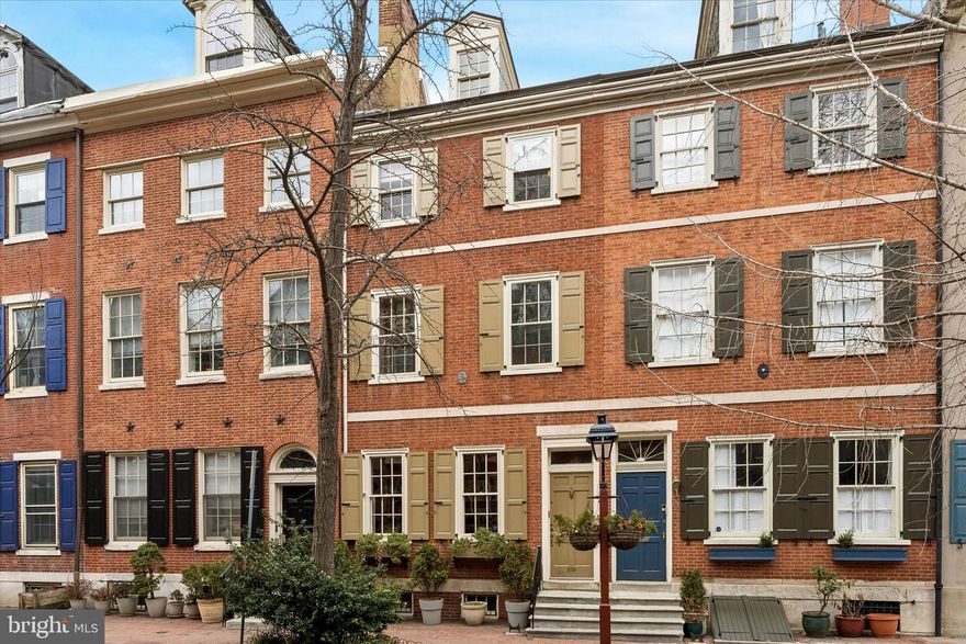 Steeped in nearly two centuries of history, 519 Pine Street is a magnificent Federal townhome built in 1809 that captures the quintessential charm of historic Philadelphia. The residence opens into a world of timeless sophistication, where hardwood floors and four classic fireplaces anchor the home’s storied past. At it's architectural heart, a two-story atrium with brick pavers, a koi pond, lush plants, and a 2nd floor iron balcony creating an unexpected sense of volume, sereneness, where it draws in natural light into the living spaces having strategically placed skylights. With four bedrooms, three and a half baths, a library, an office, an expansive living room, and a partially finished basement the layout offers a versatile balance of historic intimacy, wonderful entertaining spaces, and modern functionality.  There is a rear garden with brick pavers and mature plants with access to 5th Street and two rear decks perfect for quiet morning retreats or alfresco dining in addition to the roof deck which provides a breathtaking vantage point for taking in the Philadelphia skyline. Located in Society Hill, a historically preserved neighborhood, with Three Bears Park, Washington Square, and Independence Park as your extended backyard and a mere few blocks away from fantastic restaurants, CVS, grocery stores, cafes, and the Ritz theaters. Also, easy commuting with the entrance to 95 and 676 a 6 minute drive and only a 15 minute ride to the airport.