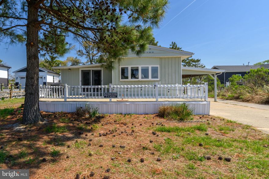 Welcome to your coastal retreat in Pot-Nets Bayside community in Long Neck!  This charming 3-bedroom, 2 full bath home offers approximately 1,450 square feet of comfortable living space, perfectly blending functionality and coastal charm. Start your mornings or unwind in the evenings on the spacious front deck, where you can enjoy beautiful water views of the marina and refreshing coastal breezes.  Or hop on your golf cart and head over to the Paradise Grill for food/drink and live music.  Designed with convenience in mind, the property features an oversized carport with room for up to 6 golf carts—ideal for this golf-cart-friendly community—as well as a generous driveway that accommodates up to 8 vehicles, making hosting family and friends effortless.  Recent updates include a brand new HVAC system installed in Fall 2025, providing peace of mind and energy efficiency for years to come.  Living in Pot-Nets Bayside means access to incredible amenities, including two community pools, a private beach, scenic ponds ideal for fishing, and piers for crabbing—everything you need to fully embrace the Delaware coastal lifestyle. Whether you're looking for a full-time residence or a vacation getaway, this property offers it all.   Listing agent is also owner.