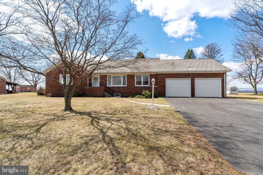 Charming Handcrafted Ranch with Scenic Mountain Views Discover the timeless charm of this 3-bedroom, 1.5-bathroom ranch home, meticulously built by hand in the 1950's and lovingly maintained by its original owner. Situated on just over half an acre, this 1,242 sq. ft. brick home offers a rare blend of craftsmanship and comfort.Step inside to gorgeous hardwood floors and handcrafted wooden baseboard covers, showcasing the home's attention to detail. The spacious living room flows into an attached dining area, both bathed in natural light. A full basement and attic provide plenty of storage, while the two-car garage adds extra convenience. The flat backyard is a true highlight, backing up to a peaceful cornfield with breathtaking mountain views—a perfect setting for relaxation or entertaining. The home is equipped with central AC and oil heat, both well-maintained and in excellent working condition. Located in the Pen Argyl Area School District, this home offers both privacy and accessibility, with schools, parks, and local amenities just minutes away. Don’t miss your chance to own this one-of-a-kind, handcrafted home—schedule a showing today!