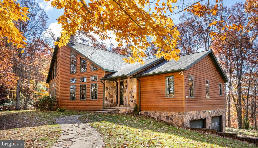 Looking for a private mountain getaway at the lake on 2 acres with lake access? Look no further, Wooded Kingdom has just what you're looking for! Tucked in on 2 private and wooded acres of ground in the Loch Glade Sanctuary sits this exceptionally well maintained and recently upgraded 4 bedroom home with 4 full bathrooms and over 4400 square feet of living space. Enjoy a warm fire in the living room where the masonry extends to the tall, vaulted ceilings. Plenty of room for the avid outdoor enthusiast to keep their toys in the 2 car attached garage or 2 car detached heated garage. Take a stroll down to the bottom of the hill to the lake access area to enjoy one of the most private areas of Deep Creek Lake. Home is an established vacation rental with Railey Vacations "Wooded Kingdom". Septic increased to 4BR capacity in 2025 and 4th bedroom added. Call today to schedule a private showing!