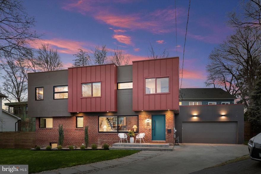 OPEN Sat, Mar 28th  1-4pm& Sun Mar 29th 12-2PM
Welcome to Arlington's Jewel Box! Architecturally Distinct Contemporary Residence – Fully Renovated with Designer Finishes.
This exceptional contemporary home seamlessly blends striking architecture with refined European craftsmanship. Fully renovated with a second-floor addition in 2017, the residence offers bold design, premium materials, & thoughtfully engineered storage throughout.
The main level  showcases a dramatic open loft aesthetic with exposed modern ductwork, discreet LED recessed lighting, & a stunning custom floating metal staircase designed & fabricated by a sculptor artist, featuring solid 2-inch oak treads. A breathtaking 20-foot restored exposed brick fireplace serves as the home’s original architectural centerpiece. Premium Western all-aluminum windows paired with Windsor windows bring in abundant natural light, complemented by Hunter Douglas blinds throughout. A whole-home integrated audio system extends to the kitchen, living room, TV room, & deck.
Custom built-ins elevate everyday living, including bespoke cabinetry by Leicht (Germany), custom coat & shoe storage with motion-activated lighting, dedicated vacuum storage, decorative open shelving with track lighting, & thoughtfully designed organizational systems.
The luxury European designer kitchen by Leicht (Germany) blends striking aesthetics with exceptional functionality. Fully paneled appliances maintain a seamless look while precision-engineered cabinetry maximizes storage with a pull-out pantry system, full-extension spice rack, concealed glass appliance garage, & custom interior drawer fittings. Imported German countertops & a dramatic waterfall island anchor the space. Architectural details include a flush backsplash window overlooking the garden, integrated adjustable lighting with remote dimming controls, LED soffit lighting, & a BEST commercial-grade concealed exhaust system.
The dining area is highlighted by sculptural designer light fixtures suspended dramatically from the 20-foot ceiling & positioned at an artistic angle to complement the architecture.
The main level bathroom features a freestanding vanity with quartz countertop, vessel sink with black brass touch-activated faucet, black bronze designer shower fixtures, & a Duravit dual-flush toilet. The space is finished with award-winning “Fossil” porcelain tile by Refin Ceramiche (Italy) inspired by prehistoric ammonite patterns, paired w/large-format Italian porcelain flooring & SONNEMAN designer lighting.
A main level bedroom includes custom oak shelving crafted by a local artisan & a modular wall storage system.
Upstairs, the primary suite offers a peaceful retreat with a custom wardrobe featuring sleek sliding glass doors, a fully outfitted wardrobe system, built-in dressing table positioned for optimal natural light, integrated audio speakers, & a ceiling fan.
The spa-inspired primary bathroom features a floating Duravit double-sink console w/ minimalist cabinetry, real wood-textured surfaces, ceramic basins, and a Duravit toilet with WonderGliss water-repellent coating. The wet area includes a freestanding jetted soaking tub and glass-enclosed shower. Statement “Folded” wall tile by Mutina Milano (Italy) creates sculptural dimension, complemented by large-format Italian porcelain flooring and an oversized flush mirror with modern lighting.
The Jack-and-Jill bathroom features playful Italian porcelain hexagon tile, oversized shower tiles, a wall-mounted Duravit double-sink console with integrated storage, Duravit dual-flush toilet designed by Philippe Starck, and a tub-shower combination.
Additional highlights include a fully organized garage with custom cabinetry (lifetime transferable warranty), durable melamine storage systems, professional slat wall organization, and dedicated bike racks.
Exterior features include Hardie panel and Englert metal siding, a bespoke horizontal cedar fence, architectural lighting, & 2 HVAC's.