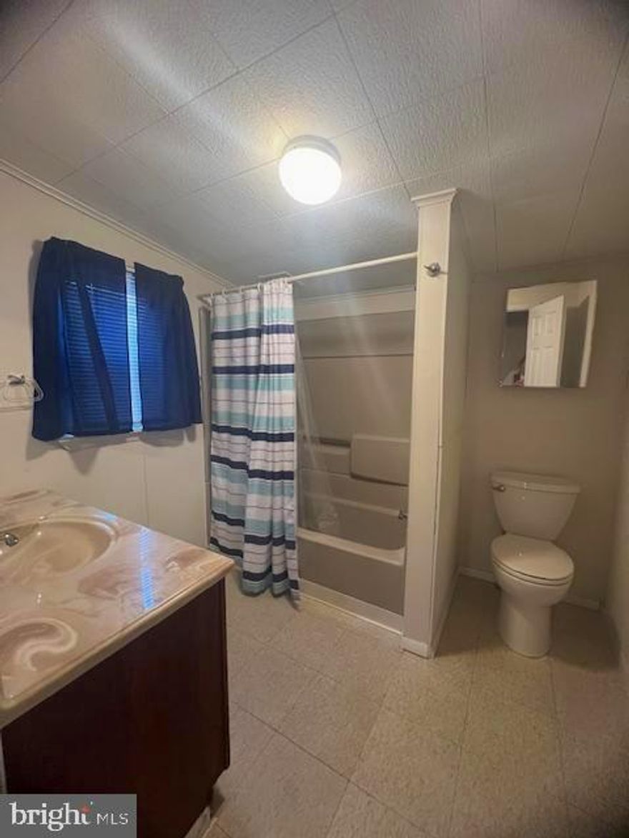 LOOK at this cute place !! Why rent when you can own!!! Super efficient natural gas heat ,with 3 new units recently installed ..Gas bills were not over $150 a month , even with this crazy cold winter ..He never even turned on the newly installed baseboard heat upstairs ,this winter ...  New Paint, new flooring ...  One car garage .
All Appliances stay!!