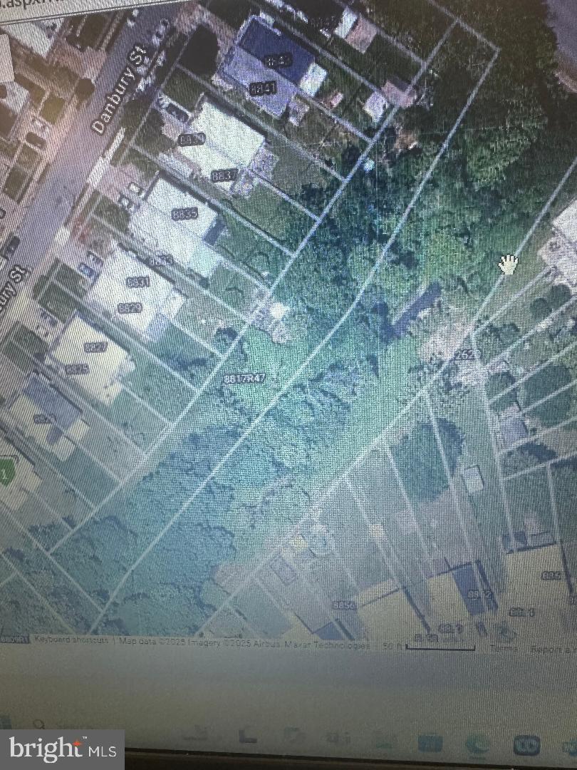 Massive 26, 191 Square Ft Lot Located in Holme Circle. Irregular Shaped - Rough Dimensions are 35 Feet Wide by 478 Feet Deep. Potential uses for this could be to develop a row of garages. You could clear the trees and park equipment or vehicles here. This lot could be subdivided and the parcels individually sold to the homeowners on Danbury Street. Use your imagination, this amount of square footage in a hot zip code is very unique and rare. It hugs the creek the entire length of the parcel (478 Feet). Lot is zoned RSA3. Annual taxes are low : $1,329. Buyer responsible for obtaining a clear U&O. Property is being sold as is. Looking for a cash deal !