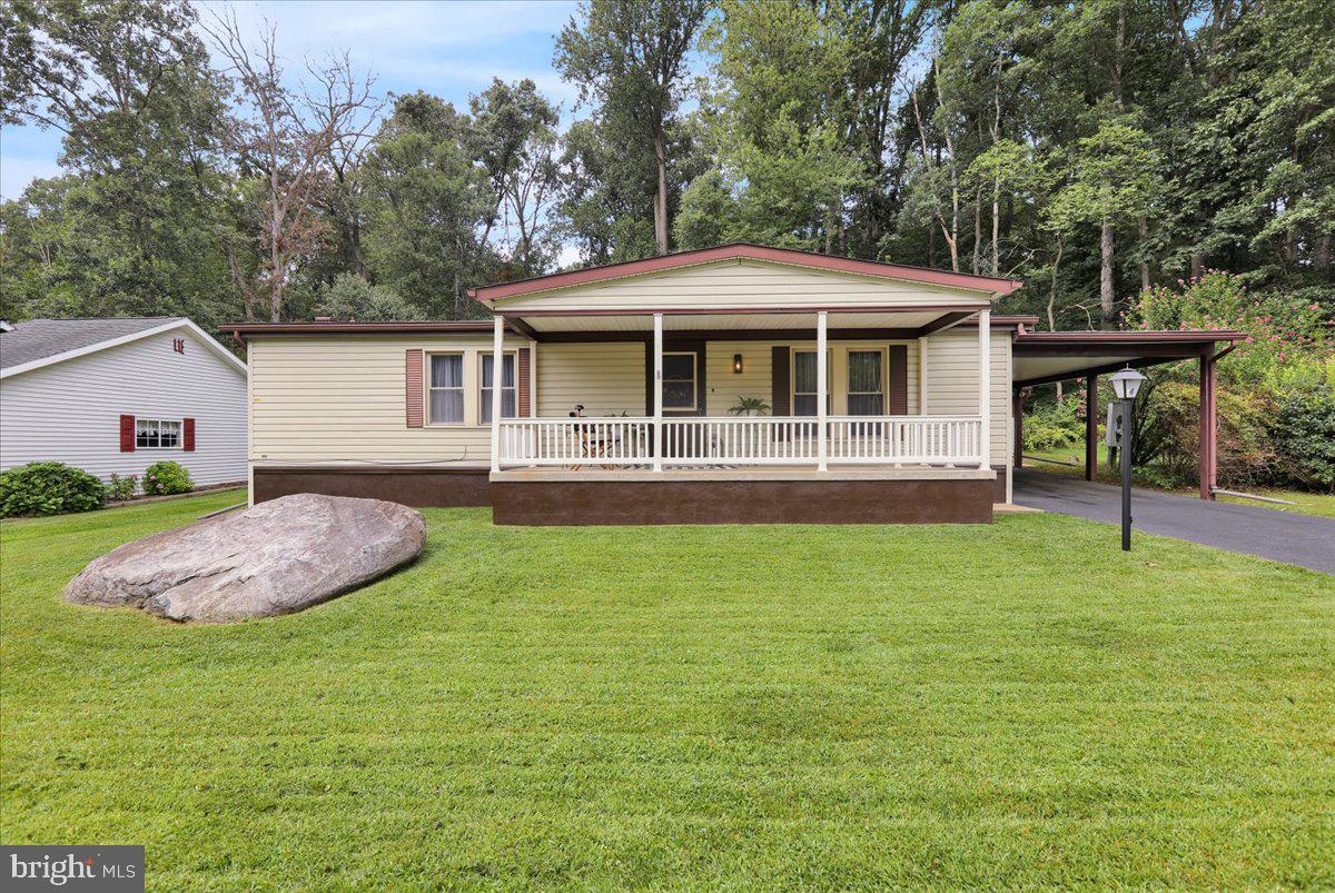 Professional Photos will be uploaded Friday 8/22/25.
Nestled in the quiet 55+ community of Gretna Springs, this double wide modular home has been completely renovated and upgraded for the next owner to move in and enjoy. It features fresh paint throughout, new Quartz countertops, new tile backsplash, new stainless steel kitchen appliances, new flooring throughout, all new light fixtures, new toilets, new vanities, some new plumbing and electrical... the list goes on and on! This 2-bedroom, 2 full bath home is a perfect blend of comfort and modern living! A bonus 4 season room provides a lovely space to enjoy the wooded rear lot and nature year-round. There is also a large, covered front porch perfect for outdoor lounging. The Shed and covered carport complete this wonderful home! Don't forget your golf cart to explore the neighborhood and take advantage of all the amenities! This home offers low-maintenance living in a friendly neighborhood setting—don’t miss your chance to make it yours!