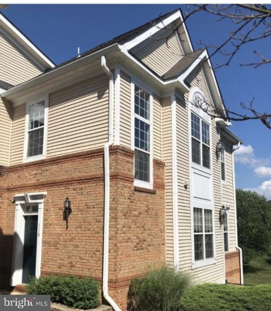 INTERIOR PHOTOS COMING SOON. NO PETS & AVAILABLE FOR QUICK MOVE IN.  Beautiful corner unit townhome style condo with 1-car garage. Hardwood floors on main level. Open concept main level living with large living room featuring gas fireplace & built-ins leading into the dining room. Kitchen with upgraded white cabinetry, stainless steel appliances & eating area leading to balcony.  Upper level primary suite with luxurious bath & walk-in closet. Second bedroom, second full bath & laundry room. One car garage & driveway parking. Rent includes basic cable & internet with Comcast, water & sewer.