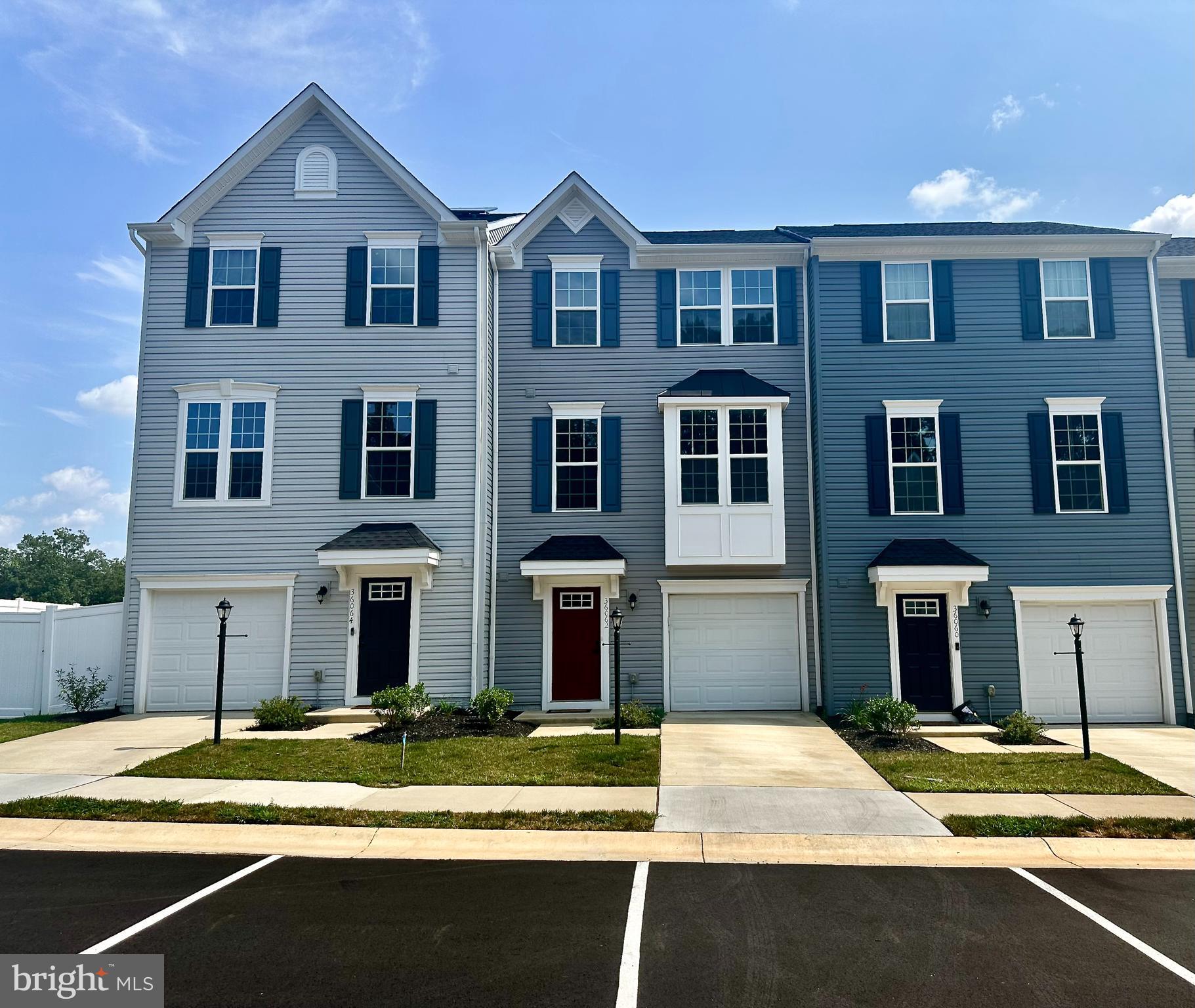 Beautiful 2 year young townhouse in Wilderness Shores with a one car garage! Walk into the first level to find a family room that walks out to the backyard. On the next level you will find an open floor plan with a sunlit Living Room and Gorgeous Well Appointed Kitchen and Dining area that open up to a maintenance free deck with a great view! The Primary Suite, with walk in closet, is located on the upper level along with 2 more bedrooms and another full bath. The washer and dryer are conveniently located on this level. Enjoy the neighborhood amenities that include walking trails, playgrounds and an outside pool! Credit Score of 620 or above required. No Pets