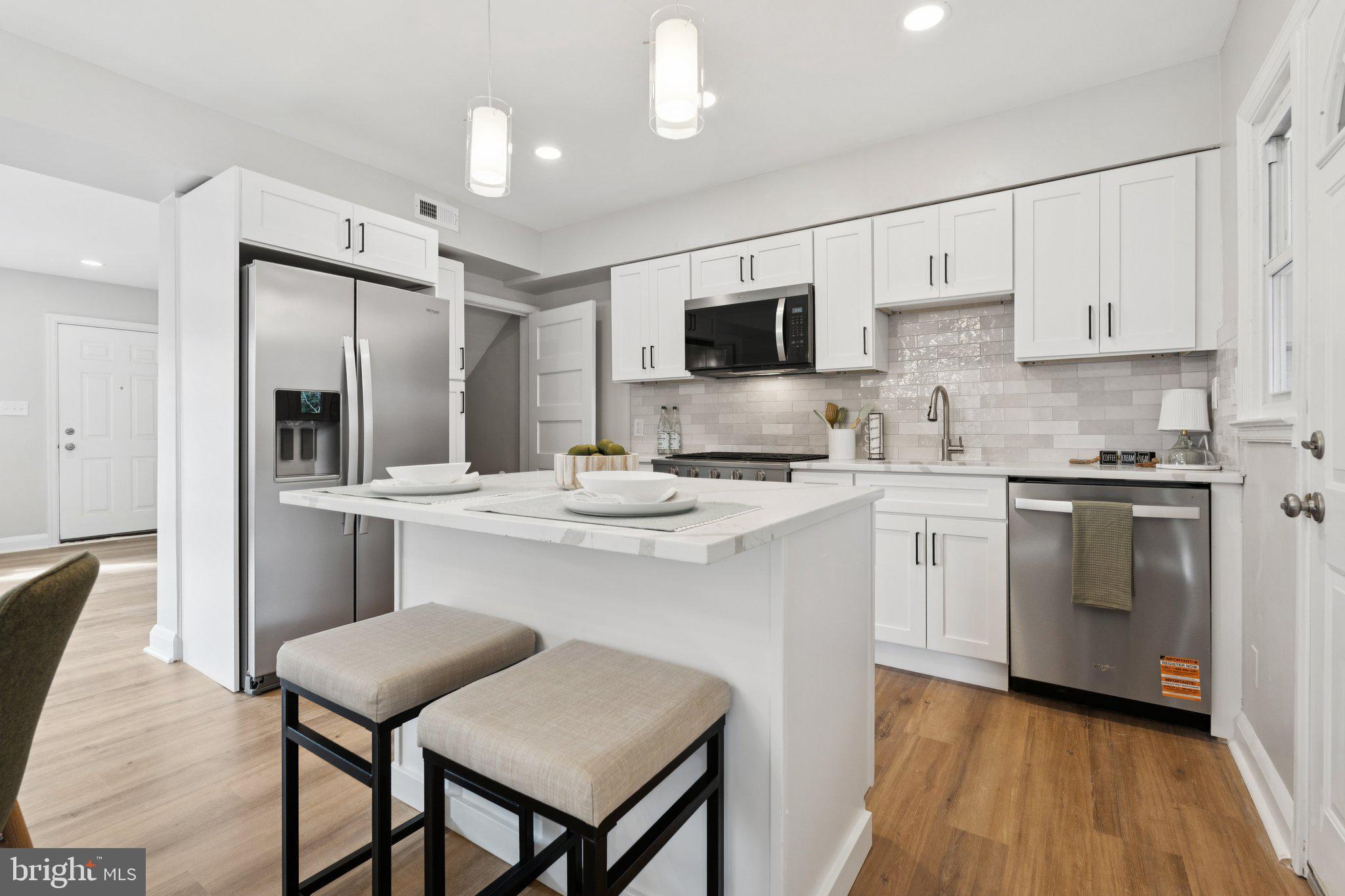 Welcome to the perfect blend of city living with a suburban feel! This beautifully rehabbed townhouse was thoughtfully redesigned with you in mind. Step inside to discover an open-concept main level that flows effortlessly from the living area to the stunning modern kitchen featuring quartz countertops, upgraded stainless steel appliances, and stylish finishes throughout. Enjoy seamless indoor-outdoor living with a newly added deck overlooking a spacious, fenced backyard that is perfect for entertaining or relaxing. With a new roof and all major systems updated within the last two years, this home offers peace of mind and low-maintenance living. Conveniently located near Belvedere Square, Towson, and local dining and shopping, this home delivers the perfect mix of comfort, convenience, and contemporary charm.