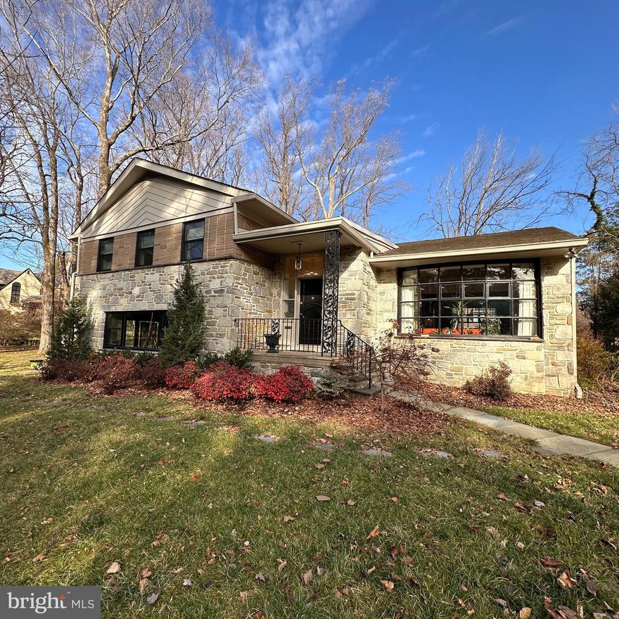 Stunning Mid-Century Modern Home in Lower Merion School District! Welcome to this beautifully updated 1960s mid-century modern home, nestled on a double-sized, professionally landscaped lot in highly sought-after Lower Merion. Offering four spacious bedrooms, two full bathrooms, and two convenient half-bathrooms, this home has been thoughtfully renovated to combine classic style with modern comfort.

Step inside and you'll be greeted by a light-filled interior where every detail has been carefully curated. The windows and doors have been fully replaced, bringing in abundant natural light while maintaining the home's mid-century charm. The main living areas feature vaulted ceilings, large bay windows and original hardwood floors. The updated kitchen is an entertainer’s dream, featuring sleek quartz countertops, modern appliances, and ample storage that provides both style and function, with easy access to multiple conversation areas.

The lower-level family room is designed with flexibility in mind—perfect for cozy movie nights by the fireplace with gas logs, hosting game nights or having a party that expands beyond the sliding glass doors and out to the lawn. Upgraded lighting inside and out enhances the warm and inviting atmosphere, while clever built-in storage solutions ensure every room remains organized and clutter-free, and seamless smart tech throughout makes managing the home a little easier. The electrical panel and service line were also recently updated, located in the generous two-car rear-entry attached garage, that also features abundant storage options.

Upstairs you'll find four generous sized bedrooms, most with original hardwood floors. The primary suite includes a large closet with a custom organization system. Both bathrooms include stone countertops, updated lighting and classic MCM decor.  Multi-zone comfort systems ensure flexible heating and cooling.

This Wynnewood custom-built home is as functional as it is beautiful. The vibrant and cheerful vibe of the space makes it an ideal retreat for family living and entertaining. Outside, the expansive lot, thoughtful design and stone patio provide a serene setting, perfect for outdoor gatherings or quiet relaxation.

Don’t miss the opportunity to own this one-of-a-kind mid-century modern gem in one of the most desirable neighborhoods around. Make it yours today!