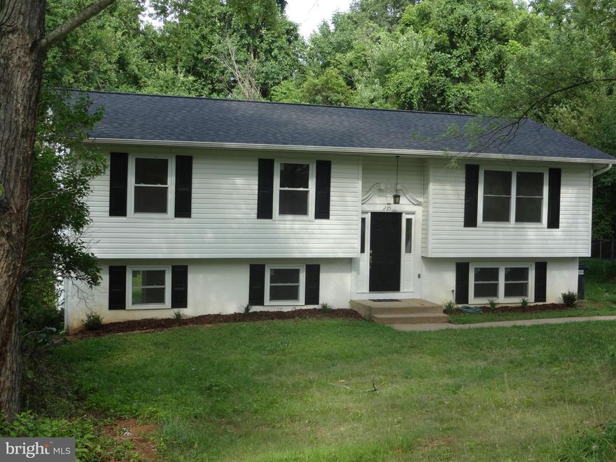 Come home to a large tastefully updated, freshly painted, split foyer with new carpet throughout, new roof, new kitchen appliances, updated lighting fixtures, and newly updated bathrooms with a large fully-fenced back yard overlooked by large covered deck!  In a quiet treed community near Stafford's beating heart, this home has 4 bedrooms and a possible 5th, and an enormous family room. No HOA.