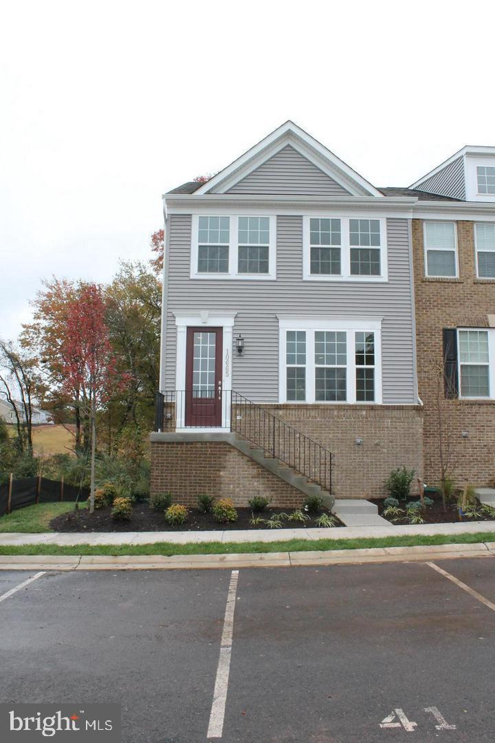 Beautiful New End-unit Townhouse (Build 2018), 2344 sq feet back to woods. Three Bedrooms, 3.5 Baths, and amazing finishes on three levels. Hardwood floors throughout main level. Open floor with gourmet kitchen, oversized island, cook top, granite tops, and double oven. The open layout allows you to be connected to dining and living areas as well as the deck all from the kitchen. Huge rec-room with full bath. Just minutes from major commuting routes 234, 28, I-66, and the VRE