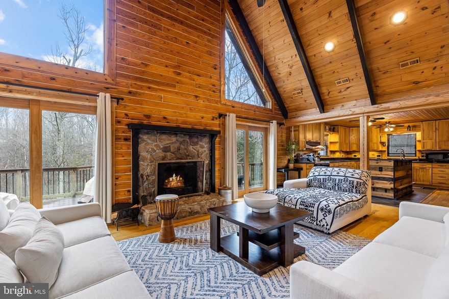 This sanctuary on nearly 6 acres of private preserve is still open for showings. Lifestyle & Location Wake up to birdsong on the front porch rocker and wind down with sunsets from the expansive back deck. Just a
 mile from Aquia Creek and the Potomac River, enjoy easy access to Hope Springs Marina, Freedom Boat
 Club, and Aquia Boat Storage—offering endless recreation and relaxation. Rustic Meets Refined Inside, over 5,250 sq ft of custom chalet-style living awaits. Crafted with kiln-dried Southland timber, the 6x9 profile logs resist rot and insects, with insulation equivalent to R39 for long-term efficiency. Flexible Layout Two upper-level offices convert easily into bedrooms, while the main-level playroom with closet and full bath offers the perfect setup for an in-law suite or private guest retreat. Just minutes from I-95, VRE, shopping, and top-rated schools—ideal for military families at Quantico, Fort Belvoir, and Joint Base Andrews. Recent  Upgrades & Features (2021–2025) Dual HVAC Units Tankless Water Heater Two Refrigerators Microwave Septic System and Water Purification Remodeled Bathrooms and Carpet Replacement Smart/Motion Lighting Tree Work, Log Treatment, Fence Repairs Bonus Barn Space A 24x40-foot barn with attic trusses adds 600–700 sq ft of versatile space—perfect for work, storage, or creative projects in this  agricultural/residential zone.