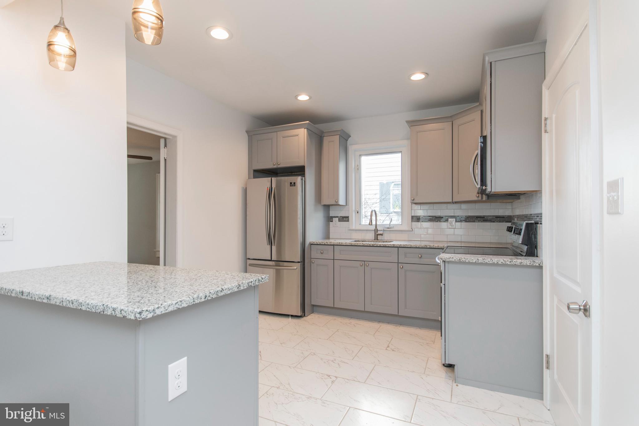Beautiful 2 bedroom, 1.5 bathroom apartment in the downstairs unit of a duplex. The apartment also features a front porch room and a spacious 4 seasons room off the back. This house was completely renovated in 2019, brand new kitchen and bathrooms, exquisite hard wood floors, refrigerator, washer & dryer included. Each unit has separate utilities (except water) and separate entrances (side & back door for this unit). The enclosed backyard is yours to enjoy for all occasions. Conveniently located to route 1 and all other local major roads. There are NO PETS allowed, tenants pay electric, water and lawn care are included in rent.