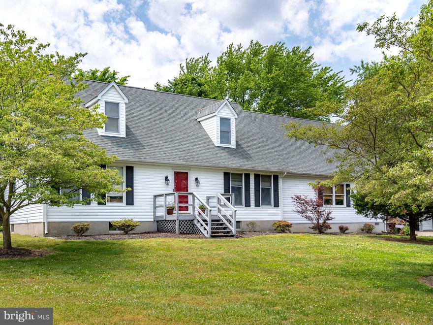 Laid-Back Country Living....This delightfully charming  home boast 4 bedrooms, 2 full baths, stylish living room, beautifully appointed gourmet kitchen with sleek cabinetry, granite counter tops, island/breakfast bar, desk area and SS appliances.  Large, yet cozy lodge-like family room/dining area with a built-in bar and stone fireplace  is the heart of the home, ultimate haven for entertaining.  Glass doors open out onto a covered porch, patio and a deck, adding to the feeling of space & openness - perfect  for gatherings, relaxing and/or dining under the stars.  Other rooms include- full basement (great spot for a rec room) and a massive storage room.  Additional highlights include an over sized garage, blacktop driveway and mature landscaping.  Make your move, this one is a winner!!!