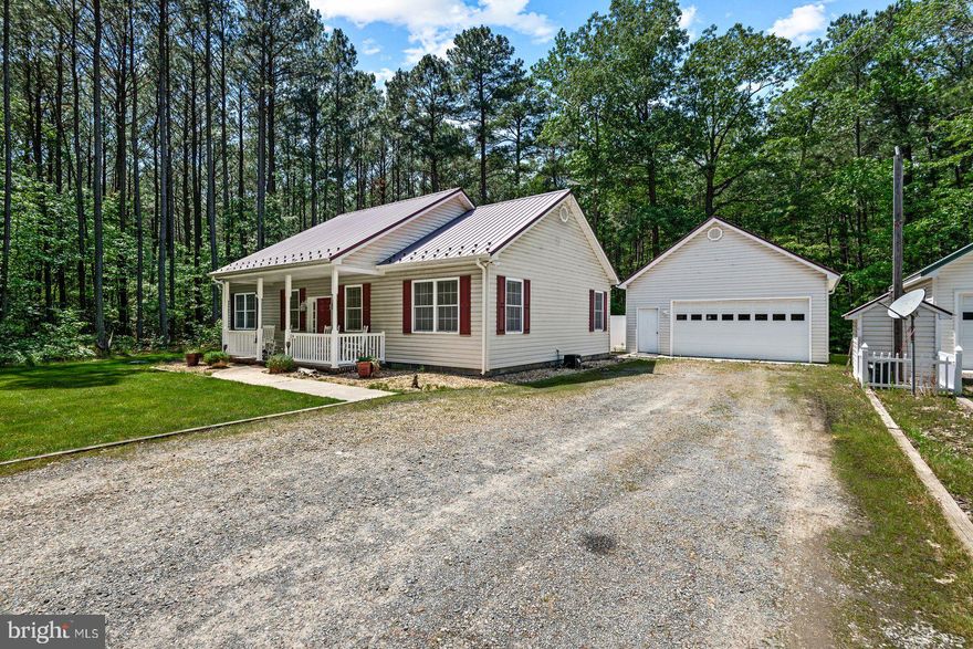 Nestled within the tranquil embrace of a water-oriented community, this exquisitely maintained home offers the epitome of coastal living on a private road. As you approach the property, the beautiful metal roof with new gutters stands out. The great room combination has cathedral ceilings with recessed shelving and lighting. There is a custom kitchen w/ shaker style custom cabinets built by Amish Craftsmen  and  granite countertops. The kitchen also features new charcoal gray stainless steel appliances. There is all new LVP flooring throughout the house and new light fixtures as well. The primary bedroom has the most incredible spa bath with massive shower & separate jetted tub, dual vanities and new ceramic tile. Feel yourself sink into so much luxury in this bathroom that you may never want to leave! The home has a split floor plan so 2 secondary bedrooms share a hall bathroom.  An exterior entrance off the driveway brings you into a utility/mudroom with your laundry/pantry space and cabinets for your coats and such. The back yard has a rear deck that leads to the above ground pool. The home also has a detached 2 car garage with plenty of additional storage space for kayaks/paddleboards and other water toys. 
COME CHECK OUT THIS GORGEOUS HOME! Close to Coles Point Marina to provide you water access for your boat. The peacefulness will draw you in and make you never want to leave.