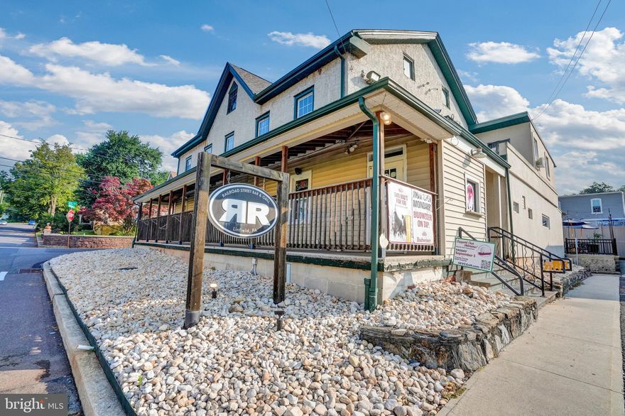 Welcome to Railroad Street Bar & Grill – a cherished landmark in the heart of Linfield, PA. Once home to the historic Linfield Hotel, this iconic Mixed-Use property has been thoughtfully transformed into a thriving Bar and Restaurant that serves as a cornerstone of the local community. The Main level features a fully operational, well-established Bar and Dining area, known throughout the region for its legendary grilled cheese sandwiches and whimsical wall of magnets – a signature touch that draws loyal patrons and curious newcomers alike. Above the Restaurant, multiple well-maintained efficiency-style apartments provide consistent rental income offering immediate cash flow. Adjacent to the Main building, a detached Barn/Garage features a beautiful new build, spacious 2-bedroom apartment—ideal as an owner's unit, Airbnb opportunity, or additional long-term rental. This rare offering combines historical charm, strong income potential, and a popular location in a community poised for continued growth. An added bonus: the sale includes an adjacent parcel (Tax ID: #37-00-03557-006), expanding the possibilities for future development or added parking. Whether you're an investor seeking a turnkey income property or an entrepreneur ready to take the reins of a beloved local business, Railroad Street Bar & Grill offers a truly unique opportunity. Don’t miss your chance to own a piece of Linfield’s legacy. Schedule your private tour today!
