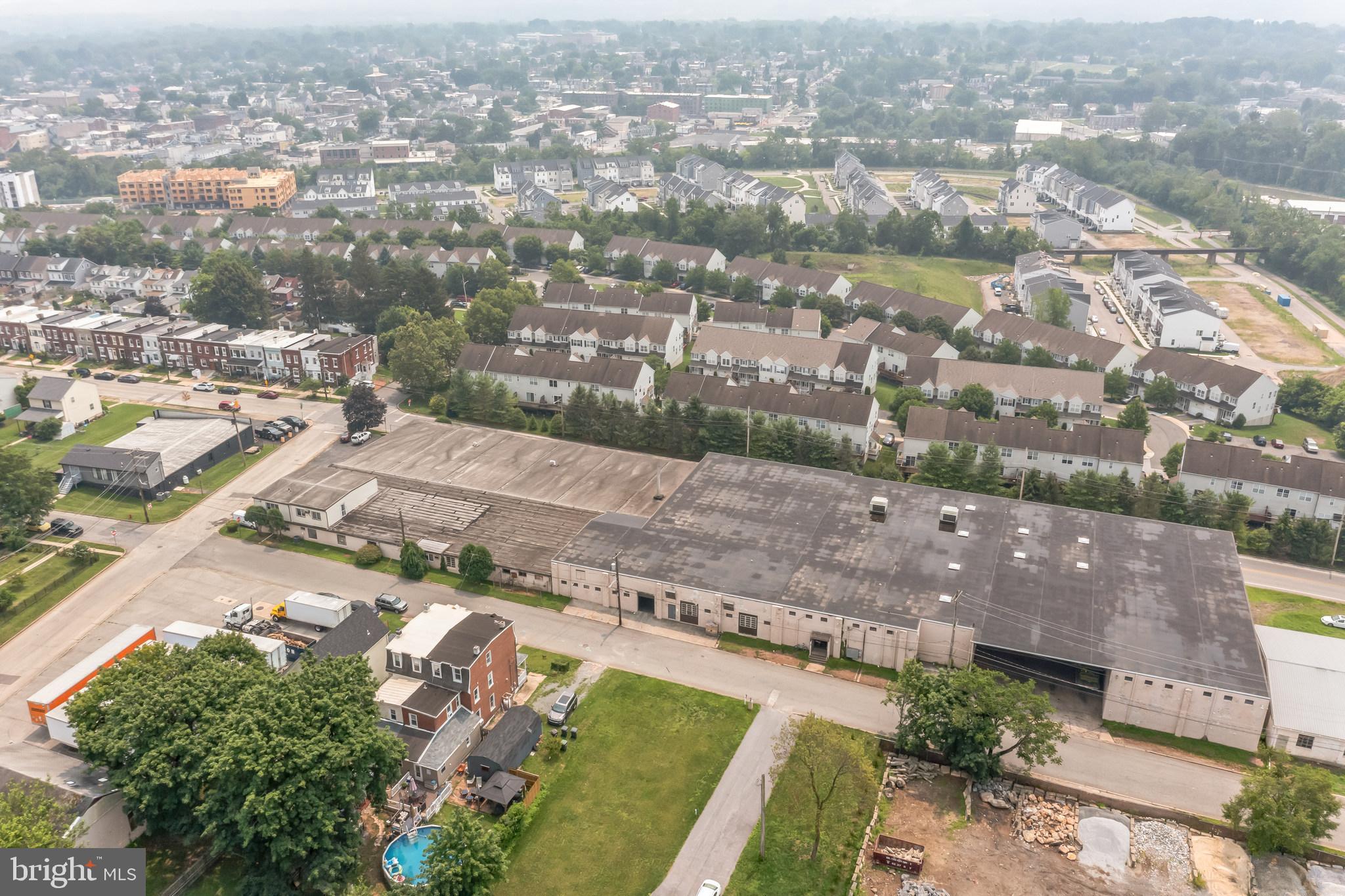 Warehouse available. 99,946 SF consisting of 54,288 SF on upper level with 16' & 12' ceiling heights. Lower Level 44,103 SF with 13' ceilings. 5 loading docks (under cover), 2 drive-in doors. Public water, sewer, and natural gas. Sprinkler 100% coverage (wet System). main offices 1,120 SF and shop offices 438 SF.