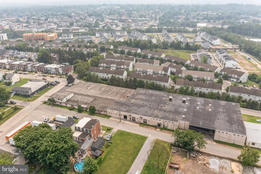 Warehouse available.  99,946 SF consisting of 54,288 SF on upper level with 16' & 12' ceiling heights.  Lower Level 44,103 SF with 13' ceilings.  5 loading docks (under cover), 2 drive-in doors.  Public water, sewer, and natural gas.  Sprinkler 100% coverage (wet System).  main offices 1,120 SF and shop offices 438 SF.