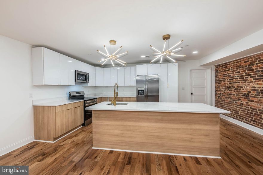 Beautifully renovated historic warehouse conversion into luxury apartments is now available.  Perfect mix of history and modern finishes, apartments feature exposed brick, hardwood floors, ultra modern kitchens with flat panels, stainless steel appliances, designer lights. This unit offers two large en suite bedrooms professionally designed and built out with natural marble and Italian porcelain tile. Extra spacious den could also be used as a bedroom, home office, or additional living area. The property was fully renovated top to bottom, sparing no expense. All systems are brand new, including appliances, HVAC heating and cooling, and more. The complex is located in a walking distance to Fells Point waterfront, Patterson Park, John Hopkins, quick drive to Canton, Harbor East and All major highways. 

Building offers garage parking at additional monthly cost.