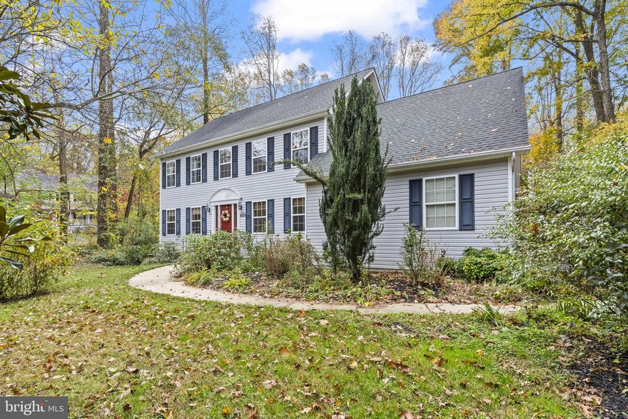 Welcome to this nicely maintained 4-bedroom, 2.5-bath home, ideally located on a quiet cul-de-sac in the sought-after Queensberry Subdivision—within the Huntingtown High School District. Freshly painted and move-in ready, this home offers both comfort and style.

As you enter through the new front door (installed in 2022), you'll find a spacious layout that blends functionality with elegance. To your right is a formal dining room featuring classic crown molding, and to your left, a light-filled living room—perfect for entertaining or relaxing.

The heart of the home is the open-concept kitchen, equipped with stainless steel appliances, a gas stove, and ample cabinet space. Adjacent to the kitchen is a cozy family room with a gas fireplace, creating a warm and inviting atmosphere. A convenient laundry room is located just off the kitchen and includes a newer washer and dryer.

Step outside THE BRAND NEW SLIDER DOOR onto the newly resurfaced and sealed deck—ideal for outdoor gatherings or simply enjoying the serene backyard. 

Upstairs, the extra-wide staircase leads you to a generous owner's suite complete with a large walk-in closet featuring custom shelving, and a luxurious en suite bath with a soaking tub and linen closet. Three additional bedrooms and a full hall bath complete the upper level.

The expansive unfinished basement with 9-foot ceilings offers endless potential for customization—whether you envision a home theater, gym, or additional living space.

Additional features include a whole-house water filtration system, a newly installed septic system (10/25) shed.