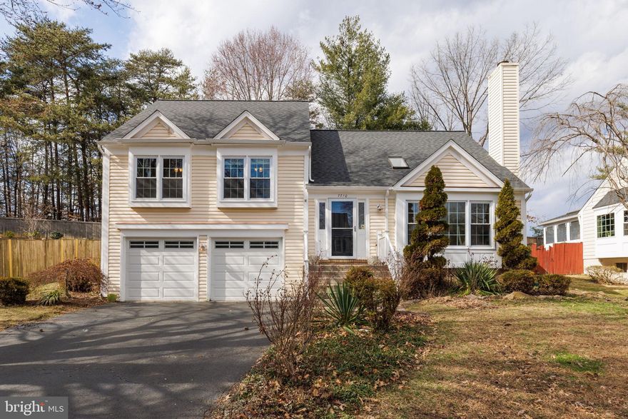 Welcome to 7710 Green Garland Drive, an outstanding Revere model in Springfield’s desirable Afton Glen. This split-level has beautiful curb appeal, a spacious 2 car garage, and hardwood floors throughout. Walk into the family room with its soaring vaulted ceilings, 2 skylights, and an inviting fireplace. The kitchen features stainless appliances, granite countertops, glass-tile backsplash, large bay window, and a center island with bar stool seating. Step out from the dining room to the huge deck and fully fenced rear grounds - the perfect space for outdoor entertainment! The owner’s bedroom has tons of natural light, a ceiling fan, and a walk-in closet with custom shelving and a stylish chandelier. The owner’s bath has a sliding barn door, a nice vanity, and modern track lighting. There are also 2 other bedrooms and a tastefully updated bath on that level. The lower level features the fourth bedroom, a nicely renovated full bath, and the laundry room. This property is in a great location close to commuter routes, shopping, Metro, and much more!