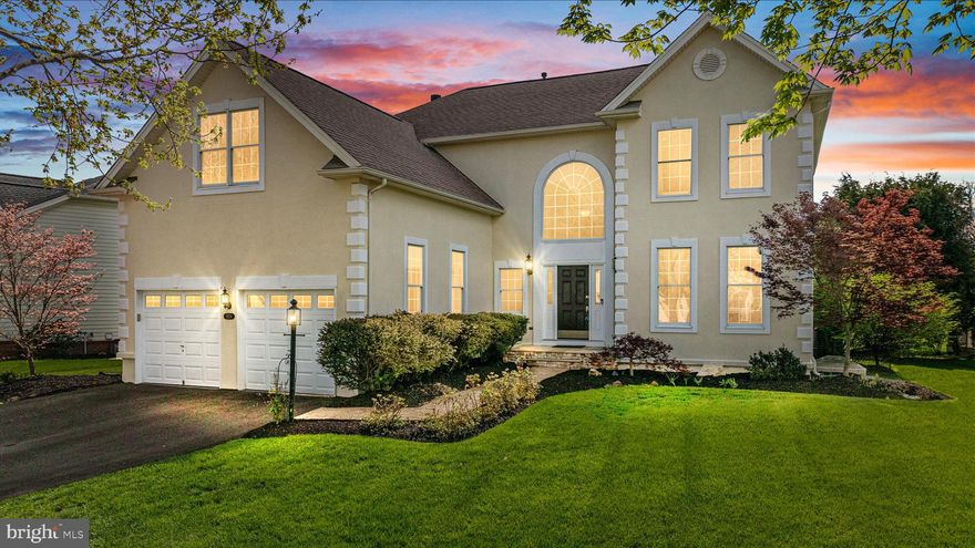 A rare opportunity to own the elegant Greenbriar model in the prestigious, gated Dominion Valley Country Club. Perfectly positioned on a premium golf course lot along the Arnold Palmer Signature Course, this home offers breathtaking views overlooking the putting green of Hole 3.
Step inside to a grand two-story foyer and a light-filled, open floor plan. The formal living and dining rooms provide timeless elegance, while stylish LVP flooring flows throughout much of the main level. The gourmet kitchen features granite countertops, a subway tile backsplash, large island, and abundant cabinetry. The adjoining breakfast area opens to a Trex deck with a retractable awning and paver patio, where you can unwind with stunning golf course and sunset views or gather around the fire pit. The property also includes an invisible fence, ideal for pet owners. The impressive two-story family room is the heart of the home, showcasing a floor-to-ceiling stone gas fireplace and a dramatic wall of windows framing picturesque fairway views. A private main-level office and updated powder room complete the main level. Upstairs, you’ll find four spacious bedrooms and three full baths, including a princess suite with its own private bath. The luxurious primary suite features a soaring vaulted ceiling, a relaxing sitting area, two walk-in closets, and a beautifully remodeled spa-inspired bath with a freestanding soaking tub and glass-enclosed shower. The finished walk-out lower level is designed for entertaining, offering a large recreation room, a theater room, and a an wet bar. A fifth bedroom and full bath provide the perfect accommodations for guests. Additional highlights include an a security system, oversized two-car garage and irrigation system. Dominion Valley Country Club is a premier gated community where refined living meets resort-style convenience. Anchored by the renowned Arnold Palmer Signature Golf Course, the neighborhood offers an elevated lifestyle defined by elegance, recreation, and connection. Residents enjoy a beautifully renovated clubhouse, expansive sports pavilion, full-service fitness center, and multiple resort-style pools, including a year-round indoor aquatic facility. Professionally maintained tennis, basketball, and pickleball courts, scenic walking and biking trails, stocked fishing ponds, and thoughtfully designed outdoor spaces complete the experience. Ideally located just minutes from the Town of Haymarket, with easy access to I-66, Routes 15, 29, and 234, as well as nearby commuter lots. Enjoy close proximity to shopping, dining, local wineries, and outdoor recreation, all within the highly regarded Battlefield High School pyramid. Recent updates include: Painted exterior (2026), Outdoor awning (2025), Stove top (2025), Driveway (2024), Hallway full bath (2024), Water heater (2023), Basement flooring (2023), Primary bath (2022), Flooring - main & upper (2021), Stone fireplace & hearth (2021), Washer/dryer (2019), Roof (2016).