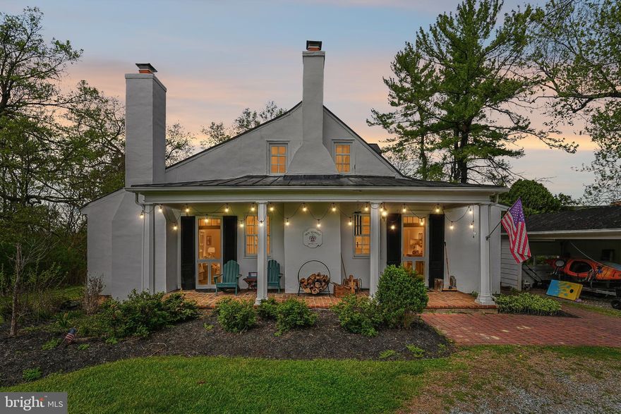 New Market is one of the oldest houses in Clarke County with the earliest section  built before 1770 as a tavern.  Historically significant and dignified, the original late Georgian and early Federal elements remain intact, including woodwork, heart pine flooring, and period hardware. The site is slightly over an acre with mature trees, offering both charm and privacy.

The house features a distinctive, largely single-level floor plan that blends historic character with modern comfort. Elegant yet warm and inviting, the historic living room, dining room and library/entrance rooms blend  naturally with a  modern and airy kitchen designed in keeping with the home’s original scale and style.

In addition, the house includes four fireplaces,  spacious living and dining rooms, and a library with built-in bookshelves. A cozy sunroom and three bedrooms with three full bathrooms complete the floor plan. 

The structure is in good condition with well-maintained mechanical systems, solid structural integrity, and the standing seam roof is in very good condition.

Outside, the fully fenced grounds feature a fire pit and a charming, historic log outbuilding with a stone fireplace and chimney, situated near the terrace off one of two side porches.

Located within the Chapel Rural Historic District, New Market offers convenient access to Route 50 and Route 7 and is just two miles north of the village of Millwood, approximately 20 minutes from Winchester and about 45 minutes from Dulles Airport.