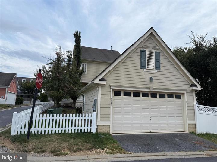 This home has an amazing classic community inverses model with all the upgrades! Hardwood throughout main level, main level features formal living and dining rooms, family room and a gourmet, eat in, center island kitchen with granite counters & upgraded 42' cabinets, lots of windows, crown molding, additional parking next to detached garage. Close to good schools, shopping, restaurants, I-270! EV Charge is installed. The basement is half finished. The total area, including the basement is 4,260 sq.