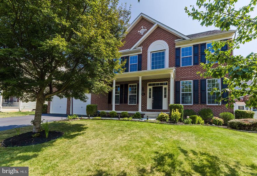 This beautiful brick front, very well maintained, 4 bedroom, 2.1 bathroom colonial has all of the spaces and finishes on your wish list.  Natural hardwood floors lead from the two-story foyer into the open floor plan family gathering area and kitchen which has real wood cabinets, upgraded granite counter top, and stainless steel appliances.  Flexible space from the Morning Room bump-out allows for a secondary option to the formal dining and living room combo, and the main floor office provides a private space for business.  Escape to a lush owner's suite with a large walk-in closet, separate soaking tub and shower, and separate dual vanities.  Three other large guest bedrooms share an updated second floor bathroom.  An unfinished walkout basement with rough-in grants storage space and an opportunity to build equity.  The home has easy access to great commuter routes, while still allowing the enjoyment of the outdoors in the safety of a smaller neighborhood from the porch or patio.