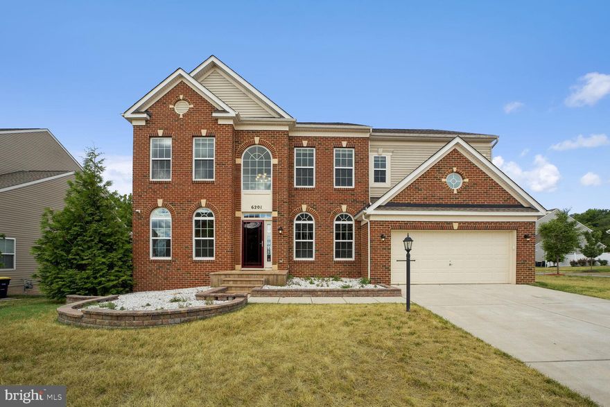 Experience the pinnacle of elegance and luxury in this stunning 5-bedroom brick front Colonial. Every inch of this magnificent home showcases impeccable design and exquisite finishes, ensuring a truly remarkable living experience.  The heart of this home is its Gourmet Kitchen, a haven for culinary enthusiasts. Equipped with sleek stainless steel appliances, it offers the ideal setting for crafting culinary delights. Adjacent to the kitchen, the sunlit breakfast room provides a serene space for your morning coffee or casual meals. From here, step out onto the expansive 16 x 24-foot deck, featuring Azek Brownstone composite flooring, perfect for relaxation and entertaining.  The finished lower level is designed for endless entertainment and relaxation possibilities. Walkout to a beautiful backyard with a paver patio, making outdoor gatherings effortless. The basement includes a bedroom, a den, a full bathroom, and recreation space complete with a wet bar.   The Upper level begins with a 2-story foyer and waterfall staircase that leads you to the 3rd floor.  The spacious primary suite boasts with 2 large walk- in closets, a completely separate sitting area space, and a luxurious bathroom featuring a whirlpool jet tub, perfect for unwinding after a long day.   The three additional bedrooms on the upper level are incredible. in  size and share an updated hall bathroom.  Located in the prestigious Vineyards of Clinton, this home offers a suburban oasis with convenient access to military and government institutions. Situated less than seven miles from Joint Base Andrews and within 13 miles of major transportation routes like I-495, Branch Avenue, and Route 301, commuting is a breeze. Enjoy nearby shopping and dining at the Tangier Outlet and outdoor recreation at parks like Piscataway Creek Stream Valley Park and Louise F. Cosca Regional Park.