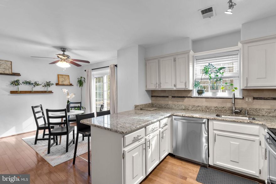 Now presenting this rarely available 3 BR / 3 BA / 1 1/2 BA Townhome in the sought after and quiet Hamlet neighborhood in South Reston that comes with two parking spaces and backs to privacy with two exterior entertaining spaces, including large kitchen level deck and downstairs patio within fenced back yard adjacent to the lower level walk out basement! Upon entry to the home, you are met by hardwood flooring and fresh paint throughout the main level that includes an updated powder room, coat closet with storage and a traditional floor plan. The living room, with crown molding, is located in the front of the home and flows to the dining area, kitchen and breakfast area with ceiling fan and access to the aforementioned deck. The kitchen includes newly refinished cabinets with new hardware, stainless appliances and granite counters throughout, including on large breakfast bar.  Upstairs are three well sized bedrooms all with carpet, ceiling fans and window treatments, including the primary bedroom with expanded closet with Elfa storage system and en-suite renovated full bathroom, with stand-in custom tile shower, updated vanity and tile flooring. Second bedrooms have closets and share a second full bathroom with soaking tub / shower combination and vanity, with linen closet nearby. The walk-out basement is 3/4 finished and includes additional living space with fresh paint, vinyl plank flooring, decorative wood-burning fireplace, custom affixed bike storage, a third full bathroom and an unfinished utility room that includes newer LG washer / dryer and expansive storage room that is the largest for any floorplan in the neighborhood.  The walk-out level basement has exterior access to fenced back yard with additional exterior patio. Roof was replaced in 2020, Water Heater in 2014 and HVAC in 2013.  The Hamlet neighborhood is a popular community that has access to all Reston Association amenities including lakes, 15 outdoor pools, 52 tennis / pickleball courts, 35 tot lots, 30 multi-purpose courts, 15 picnic / pavilion locations and 55 miles of connecting pathways to define Reston’s “Live, Work, Play” motto. The school pyramid is Terraset / Langston Hughes / South Lakes and is located nearby Hunters Woods Shopping Center, which includes grocery, coffee shops (Starbucks and Dunkin'), multiple restaurants, retail and the Reston Community Center. Glade Dr., leads to the Walker Nature Center nearby, is one of the quieter main roads in Reston and has minimal traffic. It also has many Fairfax Connector Bus Stops nearby for public transportation purposes and connects to major commuting roads Reston/Fairfax Parkways, with close proximity to the Toll Road for commuting East to DC or West to Ashburn. The neighborhood is also located within 8 miles of Dulles Airport, 3 miles of Reston Town Center, which now includes Reston Town Center Silver Line Metro Station, 3 miles from Wiehle-Reston Silver Line Metro and 2 miles from Halley Rise development that includes Wegmans. At the time of writing this listing, this property is one of four townhouse options in Reston Listed Under $650k, do not miss this chance!