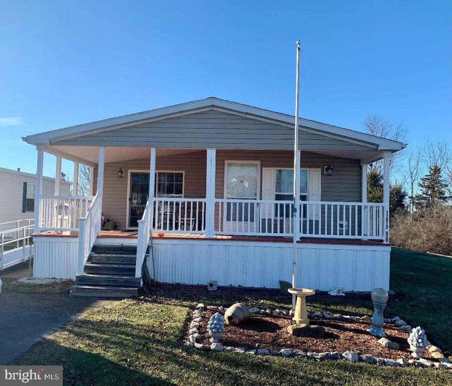 Incredibly well cared for 3 bedroom/2 full bath home, shows like new.   Offering a very classy neutral decor.  Home offers large open living room with fp and door to the front porch.  large open eat in kitchen with center island lots of cabinets, and counter space and sliding double doors to front porch.  Large primary suite with vaulted ceiling walk in closet and large primary bath with double sink and sky light for natural light.  Laundry room with side door which leads to side porch with an incredible nice handicap ramp.   The metal ramp is portable and can be removed.   Great closet space, large storage shed/shop out back with electric.  Come enjoy the outdoors by sitting on the glider on the front porch.  Electric HVAC with propane gas for the fireplace.  Home is located at the end of the cu- de sac street.  Commuter friendly close to I81 & I70 interchange.  Close to numerous shopping areas, restaurants, medical & urgent care facilities.   All buyers need to contact Lakeside Management for application approval and information regarding ground rent.  The ground rent currently $625.00 per month.  The monthly ground rent will increase to $675.00 per month effective 4/1/25. Ground rent includes work out room, pool, water & sewer.  The home title lists year built as 2008, the manufacturers book lists date as 8/2007.  This property truly will not last long.  Total sq ft is approximate. Subject to the release of contract.