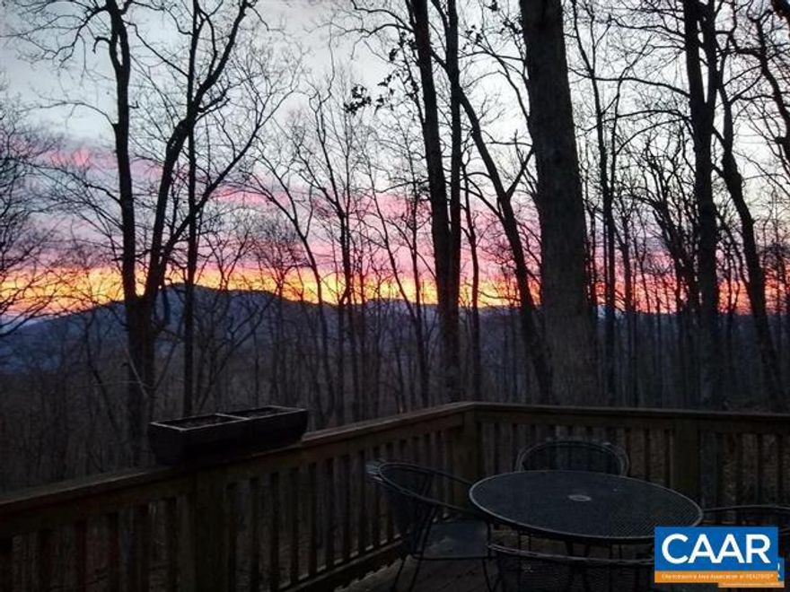 This is the opportunity you've been waiting for! If you've been dreaming of that perfect mountain getaway, now is the time to make your move.   Welcome to Inglenook, a beautifully updated mountain cottage at Wintergreen offering seasonal mountain views, and just a short distance from the main village. This cozy, move-in-ready home has been thoughtfully renovated with modern touches. The spacious wraparound decks invite you to enjoy the stunning surroundings outside.  On the main level, you'll find two bedrooms and a full bath. The living area is both airy and inviting - featuring soaring ceilings and gleaming hardwood floors. A private primary suite awaits upstairs, while the terrace-level rec room/den and half bath offer endless possibilities for additional living space or entertainment areas. A charming spiral staircase tucked in the corner maximizes usable space across all three levels.  Perfect for families and gatherings, and backing to WPOA open space, this gem offers a true mountain retreat, blending comfort and charm in a serene and private setting.,Wood Cabinets,Fireplace in Living Room