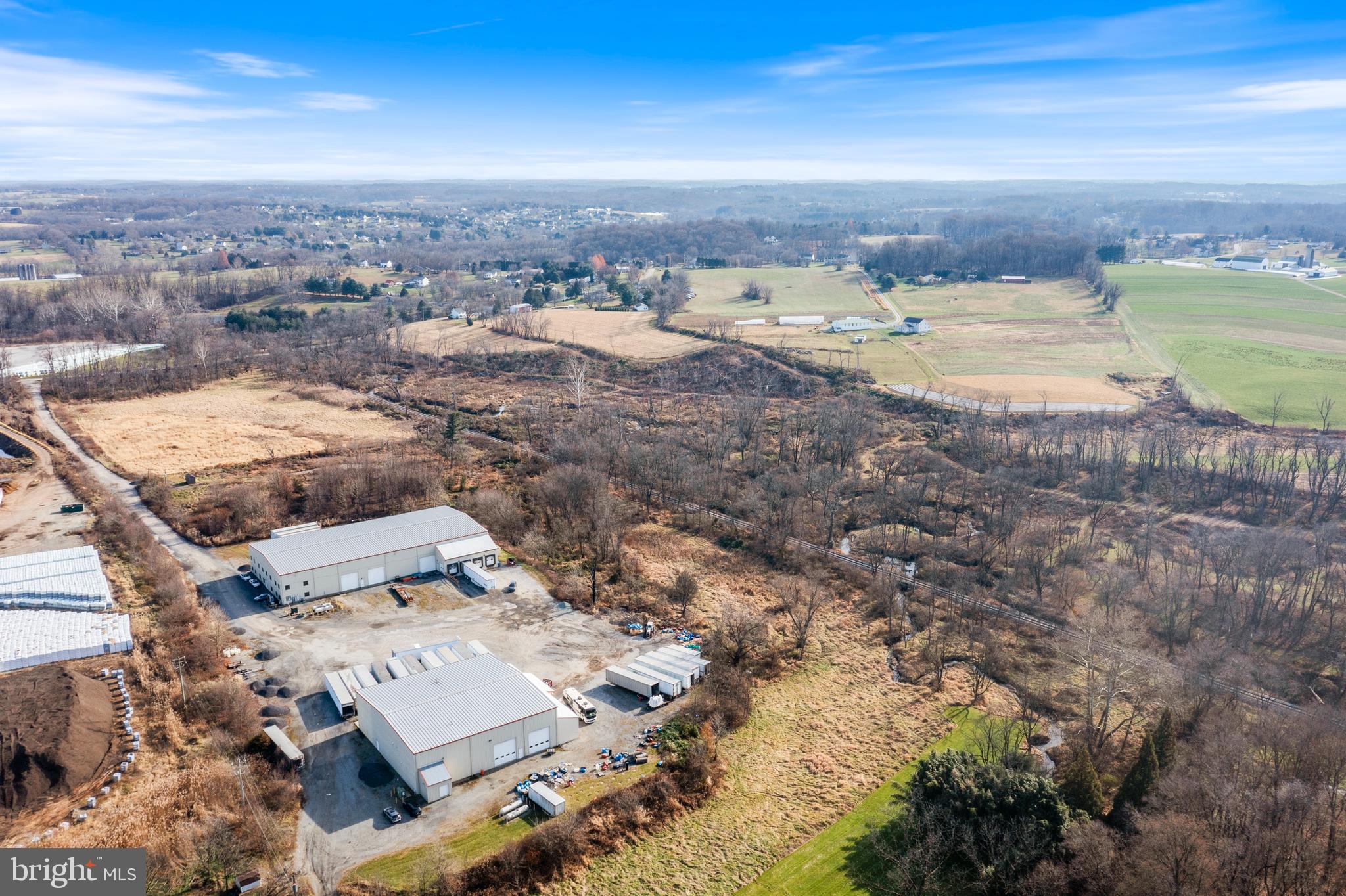 Rare opportunity to purchase warehouse space in Southern Chester County. This Industrial property consists of 2 large warehouses on 24.4 acres. Building #1 is 20,000 square feet and has approximately 5,000 square feet of refrigerated storage space, 4 loading bays that are each 16' wide and 5 large at-grade entry doors for convenience. Building 2 is 10,000 square feet and provides even more flex space for whatever suits with multiple loading bays and at-grade doors for access . Property is currently rented to a single tenant on a NNN lease that runs until the end of 2024 with an option to renew until 2027.
