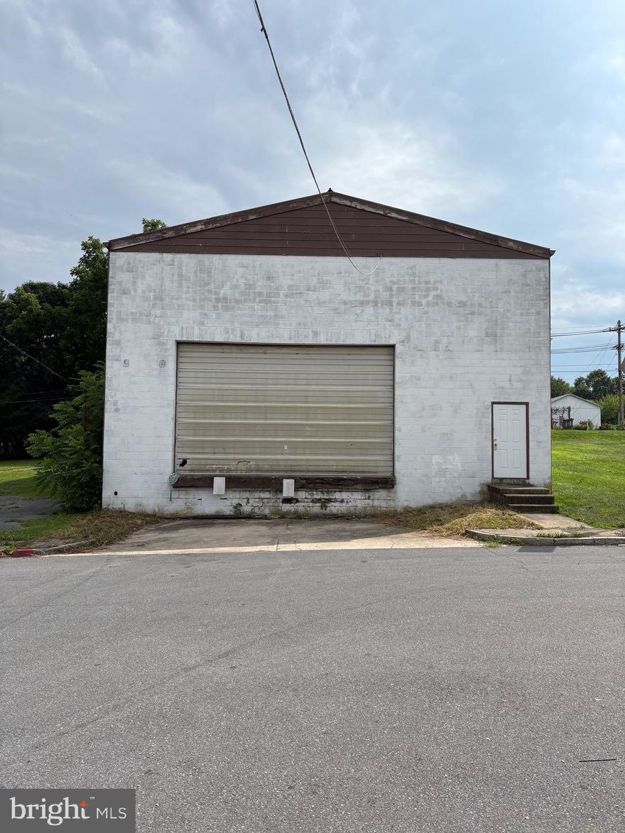 Opportunity knocks with this 3,840 square foot warehouse in a prime Hagerstown location! This commercial building features durable concrete floors, impressive 30 plus-foot ceilings (estimated), and abundant natural light from overhead skylights, creating a bright and efficient workspace.

A massive 24x24 fiberglass garage door allows easy access for trucks WITH A LOADING DOCK! The roof was repainted just 2 years ago, and the building includes two newly installed entry doors, offering peace of mind and functionality for a wide range of industrial, storage, or creative uses.

Whether you're expanding your business, seeking storage, or launching a new venture, 303 Valley Rd offers the space, structure, and location to support your vision.