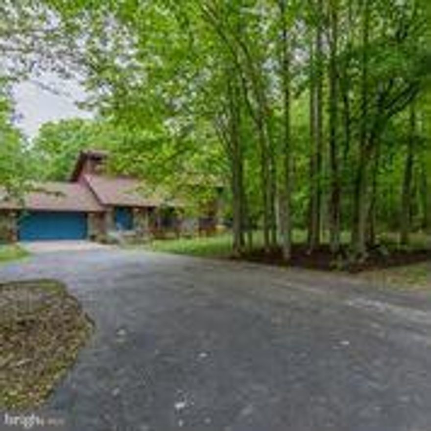 Motivated seller. Custom designed stone&cedar contemporary on beautiful 3 ac private lot. Floor to vaulted ceiling stone fireplace, sunken living room, library that can be used as main level bedroom, gourmet kitchen and breakfast room, master bath w/whirlpool tub,over size two car garage, new roof 5/16, new skylight master bathroom 5/16, walk out basement w/wood stove and recess lighting. Upgrades