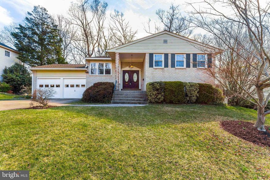 Welcome home to this beautiful brick-front split level in Cardinal Forest! You'll have plenty of room to grow in this 5 bedroom 3 bath home! Beautifully landscaped with foundational bushes and a spacious well-manicured front lawn. Walk up the steps to your covered front porch and stately French double doors, and enter into a light and bright open space layout featuring refinished hardwood floors flowing throughout the main level. Take in the stunning private view of the woods from the wall of bay windows! Entertain guests easily in the formal dining room that features a brand new chandelier, plus sliding glass doors leading to the huge deck - the perfect place for a summertime BBQ! Flow easily into the kitchen from the dining room through the open entryway. Plenty of cabinet space and gleaming granite countertops, including a breakfast bar! Your kitchen also features recessed lighting, tile backsplash, deep sink with detachable faucet, and all stainless steel appliances including a new range and microwave. Enjoy everyday meals in the neighboring breakfast nook. Relax in the main bedroom suite that features custom closets and an en-suite bathroom that features glass door shower with built in shelving. Two additional bedrooms complete the main level, plus a hall bath that features a tub/shower combo with subway tile, shelving, and rain shower head. The walk out lower level is perfect for additional living space or rec room and includes cozy gas fireplace set in a stunning stone accent wall with mantel! Pendant lighting illuminates the pool table that conveys! The remaining two bedrooms and hall bath are perfect for in-laws or guests. Laundry room with extra storage space and full size Whirlpool washer and dryer plus a rinse sink complete the level. Easily entertain on the back deck, or relax in the hot tub overlooking the woods. Park easily in the connected 2 car garage and on your long paved driveway. Recent updates include roof ('18), windows ('18), and gutter guards the high points of the roof ('18), all three bathrooms and gas fireplace. Cardinal Forest offers 2 Pools (Private). Carrleigh Parkway Park provides access to Accotink Lake Park (493 acres!) offering miles of walking & biking trails. Easily access Springfield/Franconia Metro, Express Metro Bus Service to Pentagon & DC, VRE, 495, 395 and Fairfax County Parkway. Lots of Shopping and Restaurants Nearby. Close to Springfield Town Center, Kingstowne Towne Center and Fort Belvoir. You do not want to miss this one!