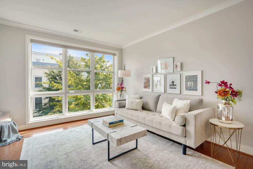 This is Where - light filled stylish living comes together in Alexandria's much sought after urban enclave. Unit #310 has all the right reasons to LOVE LEED Certified Old Town Commons with its high ceilings, impressive floor-to-ceiling windows, and East facing third floor visibility. Inside you'll find open concept living, gourmet kitchen, ENERGY STAR stainless steel appliances, elongated mahogany cabinetry, and oversized center island with granite countertops for entertaining. The list goes on with hardwood floors, ceramic tile bath, ample closet space, and sliding glass doors leading to a private balcony with relaxing cityscape views. Garage parking (P10) and extra secure-storage unit (S10) all in underground garage make this ideal location in Old Town a prime investment. Owners cherish the vibrant community with nearby restaurants, shopping, groceries, and community rec center across the street for amenities such as gym, pool and party rooms for small additional fee. Location is everything and this one includes a 5-minute walk to Braddock Rd Metro (Unit owner receives $200 per year in Metro cards), 1 mile to Old Town, .5 miles to waterfront. Desirable access to Amazon HQ2, VT Technology Campus, and Ronald Reagan Airport. LEED certification construction features on average 25% more energy efficient living with 100% compact fluorescent lighting, ENERGY STAR appliances, high-efficiency mechanical equipment, water conserving systems, and double pane windows and exterior doors. Pets appreciated. Low condo fee of $320.
- OPEN HOUSE 9/18 & 9/19 from 2-4pm.