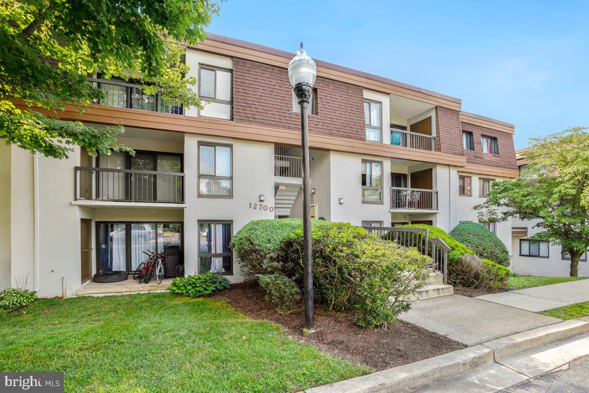Welcome to your new home at 12700 Veirs Mill Road #103! This updated and spacious 2-bedroom, 2-bathroom condo offers the perfect blend of comfort and convenience. Inside you're greeted by an open-concept living area that seamlessly connects the living room, dining area, and kitchen, creating an ideal space for entertaining or relaxing. The unit has freshly installed luxury vinyl plank flooring throughout and fresh paint, ready for your decorating touches. The modern tiled kitchen features ample cabinet space and a breakfast nook for casual dining by the window. The primary bedroom boasts an en-suite bathroom and generous closet space, while the second bedroom provides flexibility for guests or a personal retreat. A second convenient full bathroom completes the space. Enjoy the convenience of in-unit laundry, an additional storage unit, and parking. Located in a prime area, this condo is just minutes away from shopping, dining, and public transportation. It is an ideal choice for those seeking a vibrant community and easy access to urban amenities.