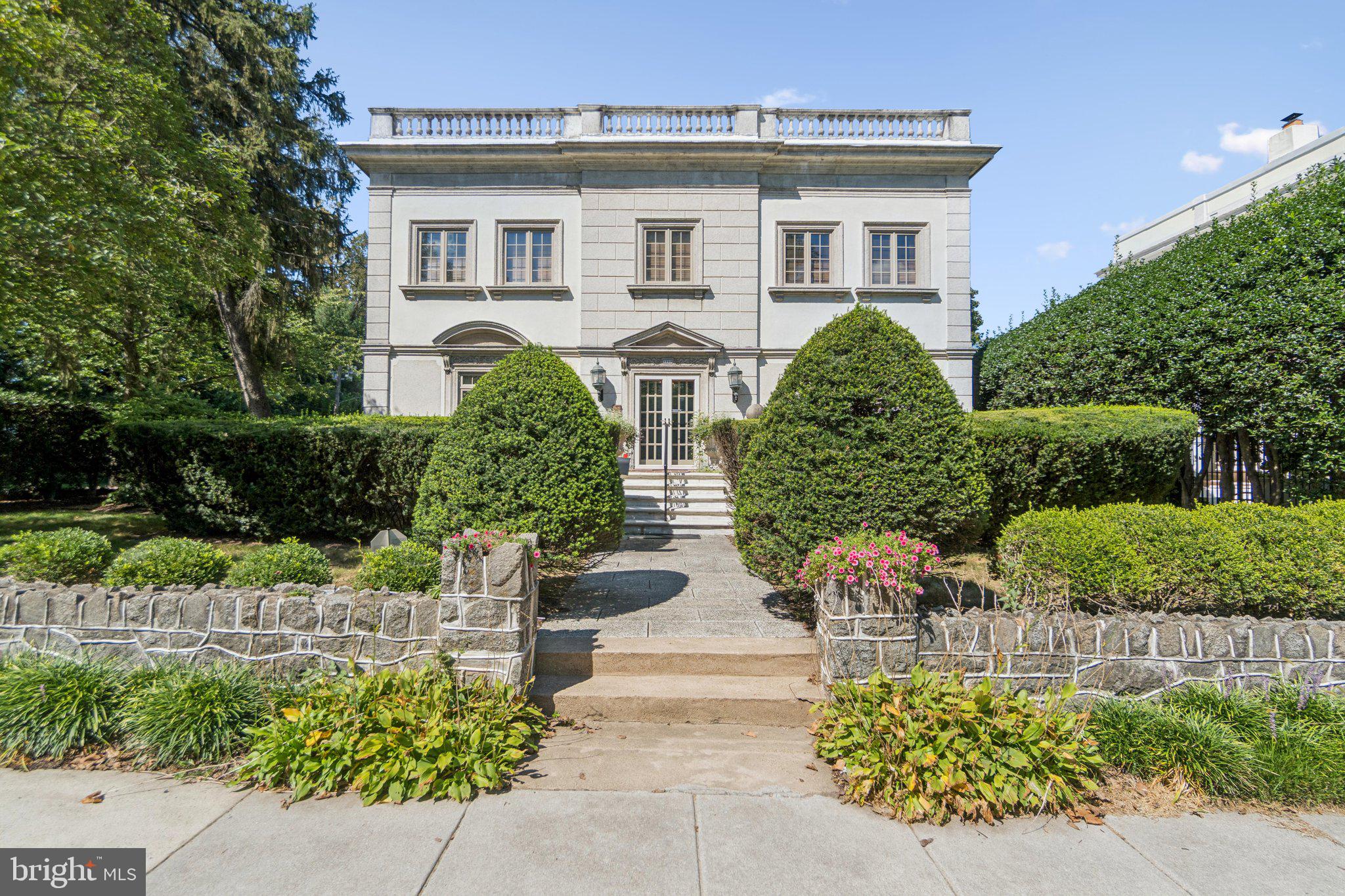 7200 Connecticut Avenue is one of the celebrated Lozupone Houses—an extraordinary trio of Italian Renaissance Revival residences built in 1925 by the Lozupone brothers, renowned ornamental plasterers whose artistry shaped Washington’s great landmarks, including Union Station and the U.S. Capitol. Their Old World craftsmanship remains beautifully preserved here, thoughtfully balanced with modern updates for today’s lifestyle.
Inside, the home’s original plasterwork, marble details, and decorative moldings highlight its historic character, while gracious entertaining spaces—including a formal entry hall, elegant living room, and grand dining room—evoke a timeless sophistication. Nearly every room opens to the outdoors, connecting seamlessly with terraces, gardens, and the home’s landscaped grounds. A two-story addition extends the home with a spacious family room on the main level and a private guest suite above—ideal for multigenerational living, visitors, or a secluded home office.
Upstairs, the main house offers three bedrooms and two full baths. The serene primary suite features a spa-like bath with soaking tub, dual vanities, frameless glass shower, and a generous walk-in closet. French doors open to a balustraded terrace, completing this retreat. Additional bedrooms each showcase unique style and share a well-appointed hall bath.
The expansive lower level adds flexible living space with a family room, full bath, laundry, and abundant storage. Outside, the 12,000 sq. ft. lot provides a private courtyard with fountain, a large flat lawn, and a detached two-car garage.
Blending artistry, elegance, and comfort, 7200 Connecticut Avenue offers a rare chance to own a piece of Chevy Chase’s architectural and cultural heritage.
Square footage is approximate and should not be used for property valuation.