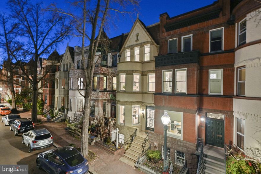 Welcome to Riggs Place - the prettiest block in Dupont Circle. This remarkable Victorian rowhouse is nestled on a picturesque tree-lined street in the vibrant heart of Dupont Circle. The home seamlessly blends upscale modern living with timeless period charm. Boasting 5 bedrooms, 3.5 bathrooms, and radiant hardwood floors throughout, it exudes elegance at every turn. The sun-drenched interior features high ceilings, skylights, and bay windows, while a rooftop deck offers a serene escape. The chef's kitchen is a culinary haven with a Wolf stove, stainless steel appliances, and granite countertops. Additional highlights include a separately-metered basement unit and secure parking for two cars. Enjoy the convenience of walking to the Dupont Farmers Market, the Metro, renowned dining establishments, parks, entertainment venues, and everything the District has to offer.