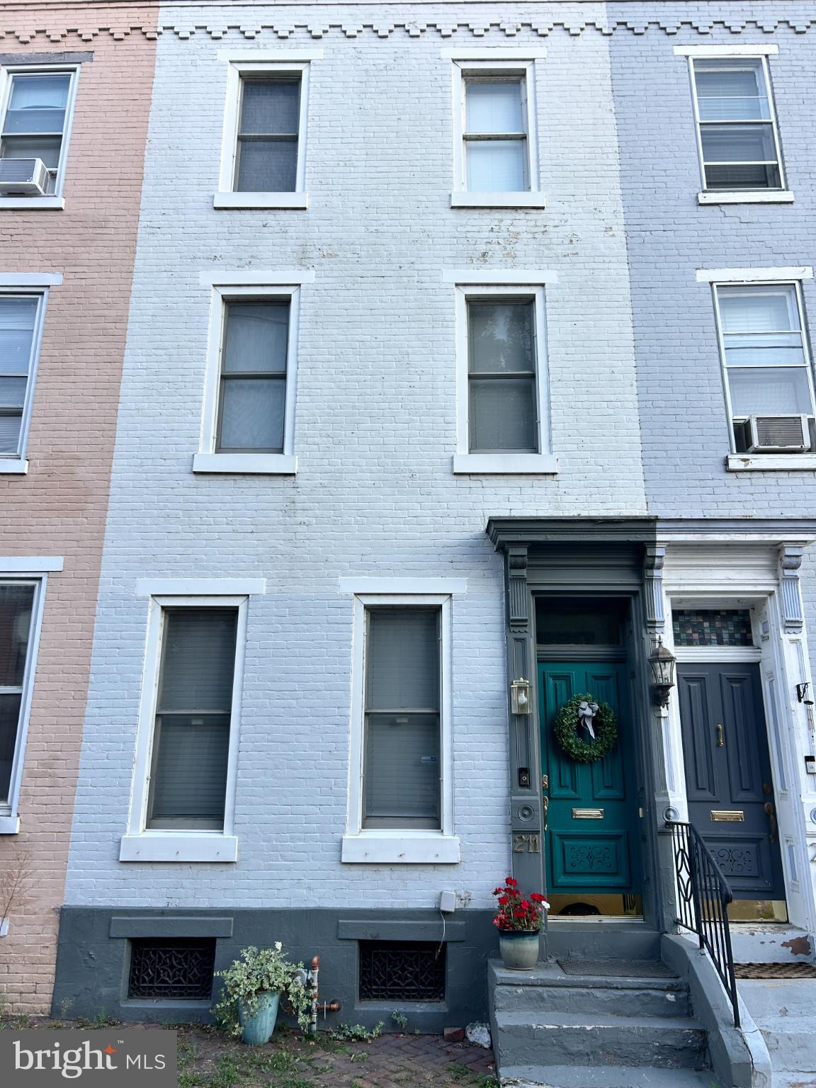 Nestled in the heart of the Midtown Historic District, this stunning interior row townhouse, built in 1890, is a true testament to timeless craftsmanship and contemporary design. With 1,590 square feet of potential, this property invites you to reimagine its spaces and create a home that reflects your unique style. The exterior, adorned with classic brickwork, exudes character and charm, while the contemporary architectural style offers a fresh twist that harmonizes with the historic surroundings. Step inside to discover a canvas ready for your vision-an open layout that encourages creativity and flexibility, perfect for entertaining or quiet evenings at home. Natural light floods through the windows, illuminating the rich textures and details that define this residence. The basement offers additional space for storage or a workshop, enhancing the functionality of this remarkable property. Conveniently located within 5 miles of a commuter rail station and less than 10 miles from the airport, this home provides easy access to the city while maintaining a serene neighborhood atmosphere. On-street parking ensures that your guests will always find a place to visit. Embrace the opportunity to own a piece of history and transform it into your dream home. This property is not just a house; it's a canvas for your aspirations. Don't miss your chance to make it your own!