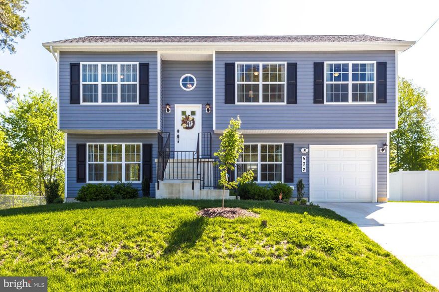 Beautiful home in Town of La Plata. Just like new! Home built in 2019 and shows very well.  Beautiful custom paint colors, rustic grey flooring, expresso kitchen cabinetry, granite counters & modern light fixtures through out. Spacious master bedroom on upper level + 2 additional bedrooms/ 2 full baths. Gorgeous Matching cabinetry and tile in all bathrooms. Lower level walks out to backyard oasis, large flat yard that is perfect for entertaining & bonfires. Bonus: Spacious laundry room w/ lots of storage. NO HOA!  This home sits nicely in the Town of La Plata, enjoy summer concerts at Town Hall or Holiday parades. Walking distance to local park. Take a peek soon, you don't want to miss out!