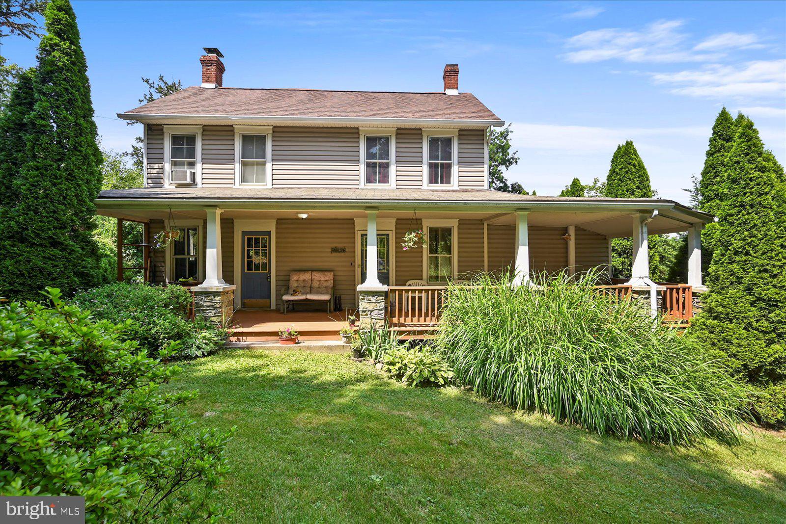 Charming 3BR/2BA farmhouse with 2,498 sq ft of living space on a spacious 0.5-acre lot. Originally built in 1900, this home blends historic character with generous living areas, including a cozy living room with fireplace, separate dining room, large family room, and a versatile enclosed porch perfect for a home office, playroom, or bonus space. Enjoy peaceful outdoor living on the large covered front porch and a fenced backyard—ideal for relaxing or entertaining. A rare find with timeless charm and plenty of room to make it your own!