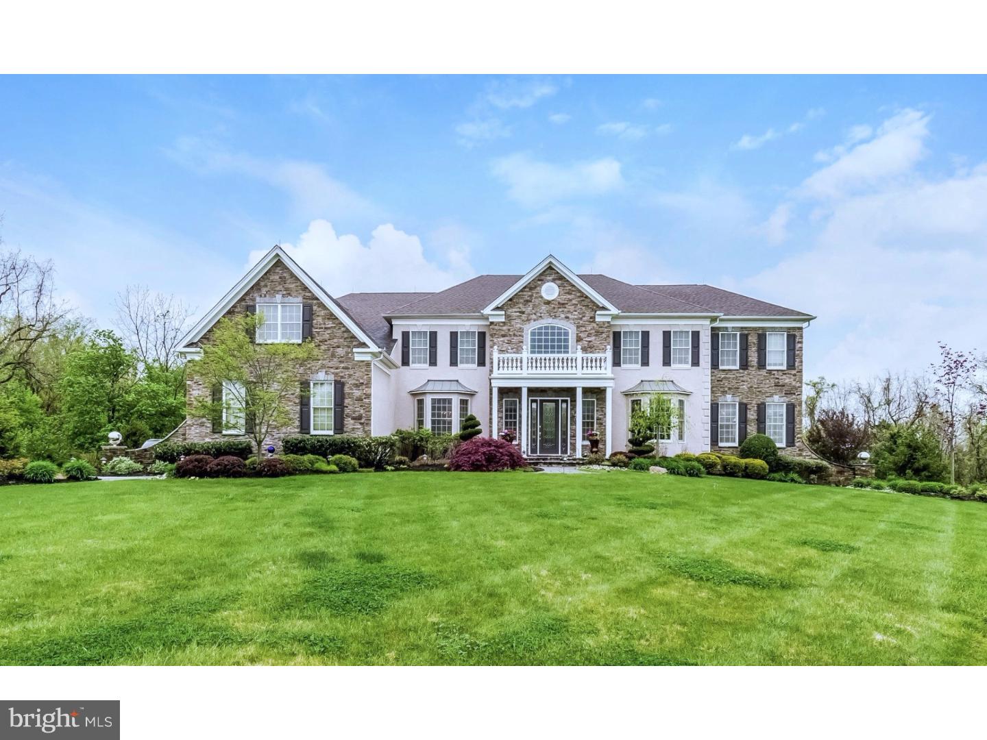 Vacation at home in your very own oasis. This 5 bedroom 4.1 bath home majestically sits on the most coveted private home-site backing to preserved land in the neighborhood. The backyard will melt your heart and take your breath away. Purposefully designed, the excitement starts the moment you step outside. As you descend from the raised patio, step down to a fabulous marble lower patio connecting you to the amazing pool area complete with a full side of waterfalls, full illumination supplemented by gas fire light. Adjacent to the pool is your very own expertly crafted covered outdoor entertainment family room/kitchen. The yard extends beyond the fenced area and offers plenty of room for play. If the outside wasn't enough to excite, the interior will. As you enter the front door you are amazed by the tall ceilings, double butterfly stairs and the ability to see all the way to the back of the home stopping at the floor to ceiling stone fireplace. To the right is the living room and next is the conservatory surrounded in windows with a full wet bar. To the left of the entry is the formal dining room. Straight back from the entry is the family room with amazing backyard views. Next is the study with a full wall of built-ins. On the other side of the family room is the breakfast room and the amazing working kitchen complete with a custom designed over- sized center island with seating. The kitchen highlights include a professional line of appliances, top of the line furniture cabinetry with soft close, garbage compactor, a beverage center with ice maker and wine refrigerator, added moldings and details, under counter lighting and a lovely granite back-splash. The sun room is just off of the kitchen and is surrounded in glass for the best backyard view complete with easy access to the patio. The 2nd floor can be accessed from the grand stair or more informally from the back stair. The master suite retreat is a soothing place to end your day. This room includes a 2 sided gas fireplace and a lounge area, a perfect place to enjoy a book. The main bedroom has a lovely view of the backyard with entrance to your Spa bathroom complete with two furniture vanities a double walk-in shower, a centered whirlpool tub and the most beautiful custom tile. The suite is completed by another relaxation room and three walk-in closets. The rest of the upstairs features 4 generously sized bedrooms, two with a private bath and two with a shared bath. This is a must see home!
