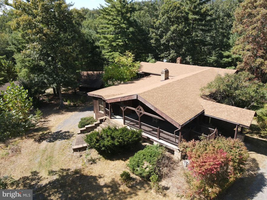 PRICE REDUCTION!!! Call now to see this very large and spacious 2 bedroom, 2 bath home with plenty of room and a basement. The home has a living room, kitchen, dining area, plus a den plus a two car garage. This large home is  located on  an 11 acre wooded parcel. There is a separate log building and  large equipment shed with workshop area.  The property needs to be updated and can use a remodel or repairs. For lots of privacy this dwelling is located near the end of a cul de sac so very few people or vehicles will be coming by.  Sit on the front porch or on the private deck and watch the deer, turkey and other animals . On a clear night you will delight to see the moon, stars, satellites and shooting stars. This is a great find for someone who wants a get away and need a rural oasis 
 The house has some items remaining  which will be left .