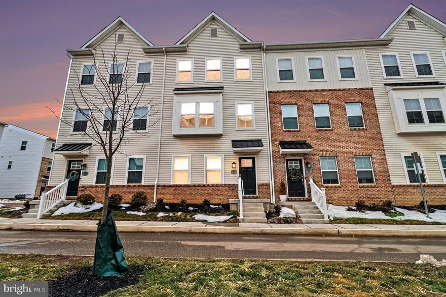 Move-in ready Cambridge Luxe townhome in the desirable River Pointe community! This thoughtfully designed 3-bedroom home offers 2 full baths and 3 half baths across four finished levels of stylish, flexible living space. The entry level features a 2-car garage and a spacious recreation room with a half bath, perfect for a home office, gym, media room, or playroom. The bright main level boasts 9-foot ceilings, oversized windows, and low-maintenance LVP flooring, along with a stunning kitchen complete with white 42” soft-close cabinetry, quartz countertops, a large island, stainless steel refrigerator, and a sleek 3x6 gloss tile backsplash, plus a dedicated dining area, expansive great room, and additional half bath ideal for entertaining. Upstairs, enjoy the convenience of a full laundry area with washer and dryer, a relaxing primary suite with walk-in closet and en-suite bath featuring dual sinks and a beautifully finished subway tile shower, and two additional bedrooms with a hall bath. The fourth-floor loft with powder room and private rooftop deck is the ultimate retreat for morning coffee or evening gatherings. This is the largest model in the community! Located in Bridgeport, just minutes from King of Prussia Mall, I-76, I-476, and Route 202, with easy access to King of Prussia, Conshohocken, and Philadelphia, River Pointe offers exceptional convenience near dining, nightlife, and outdoor recreation—schedule your tour today and move right in.