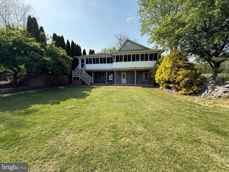 Welcome to this unique 4-bedroom, 3 full bathroom ranch-style home situated on 5 private acres in a peaceful country setting. Built in 1996, this well-constructed property offers 1,882 square feet of living space on the main level with plenty of room to spread out.

Enjoy two fireplaces, a spacious screened-in porch ideal for relaxing or entertaining, and a fantastic lower-level recreation room featuring a commercial-style bar and a cozy wood-burning fireplace. The lower level also offers flexible space—perfect for adding an additional bedroom, home office, or hobby area.

For hobbyists, small business owners, or anyone in need of serious workspace, the property features a 28’x32’ woodshop plus a massive 42’x70’ heated barn with 16' ceilings, five bays, and electric service—ideal for equipment storage, workshop use, or small business operations.

A rare opportunity to own a versatile property with acreage, privacy, and endless potential.

HUD Home – Being Sold As Is