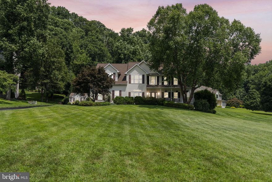 Welcome to 1970 Conan Doyle in Sykesville’s sought-after Sherlock Holmes Estates—an established, private community with minimal traffic and a peaceful setting.
Set on just under an acre backing to a wooded preserve, this home offers exceptional privacy and a true outdoor retreat. Enjoy a wrap-around front porch and a backyard oasis featuring a waterfall and extensive landscaping designed for relaxation and entertaining.
Inside, you’ll find 5 bedrooms, 3 full baths, and 1 half bath with a functional, open layout. A bright home office with French doors and oversized windows provides an ideal work-from-home space. The kitchen flows into a spacious breakfast area with cathedral ceilings and abundant natural light.
The oversized primary suite includes a sitting area and a fully remodeled bath with a deep jetted soaking tub. The walk-out basement offers additional living potential with rough-in plumbing for a future bathroom.
Major updates include a new roof, HVAC, and water heater all replaced in 2020. Conveniently located near schools, shopping, and dining, this home combines privacy, space, and modern updates in a prime Sykesville location.