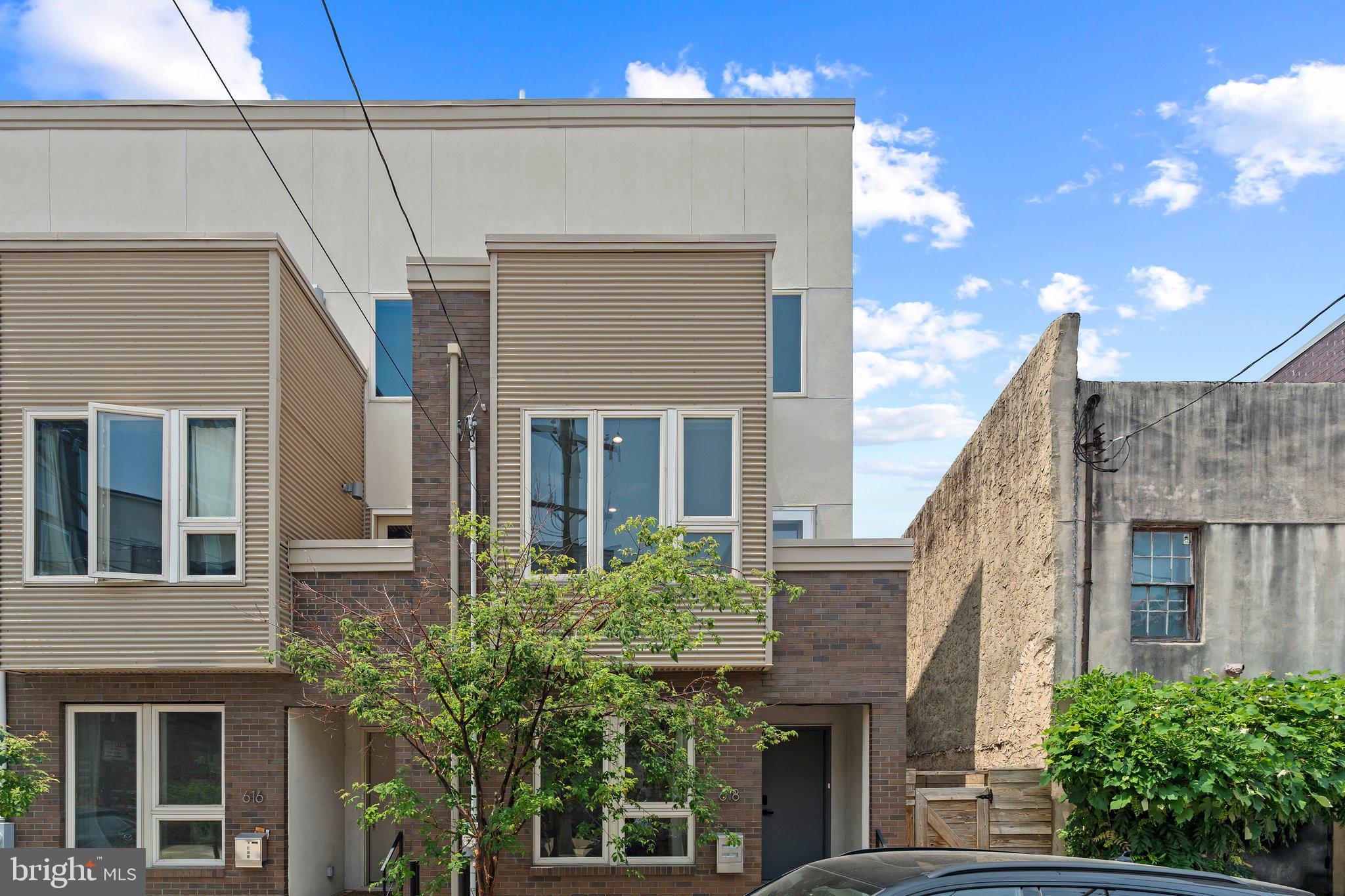 Experience refined urban living in this exceptional corner-unit townhome at 618 N American St, ideally situated in the highly sought-after Northern Liberties neighborhood of Philadelphia. Built in 2012 and thoughtfully remodeled with premium upgrades, this 3-bedroom, 3-bath residence blends modern luxury with everyday comfort. Step into a sunlit, open-concept living space featuring a brand-new gourmet kitchen adorned with sleek cabinetry, quartz countertops, and top-of-the-line stainless steel appliances—perfect for both entertaining and daily living. Enjoy multiple private outdoor retreats, including a spacious pavered patio, a walkout balcony, and a rooftop deck offering breathtaking panoramic views of the city skyline. The finished basement adds versatile living space ideal for a home theater, gym, or office. With its contemporary design, abundant natural light, and unbeatable location just steps from vibrant dining, cafes, and shops, this turnkey home is a rare Northern Liberties treasure you won’t want to miss.
